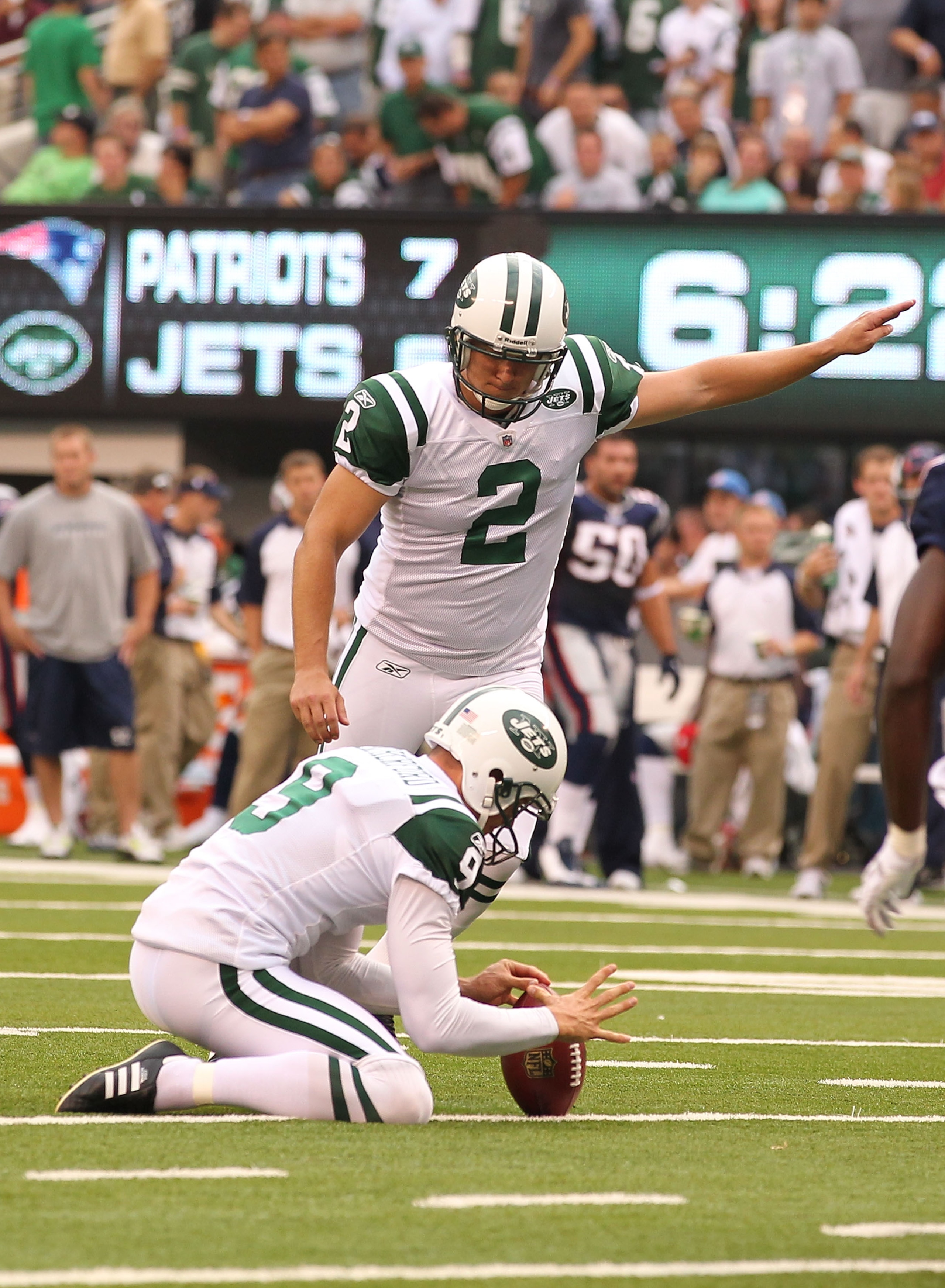 EAST RUTHERFORD, NJ - SEPTEMBER 19:  Nick Folk #2 of the New York Jets kicks a field goal as Steve Weatherford #9 holds the ball against the New England Patriots during their  game on September 19, 2010 at the New Meadowlands Stadium  in East Rutherford,