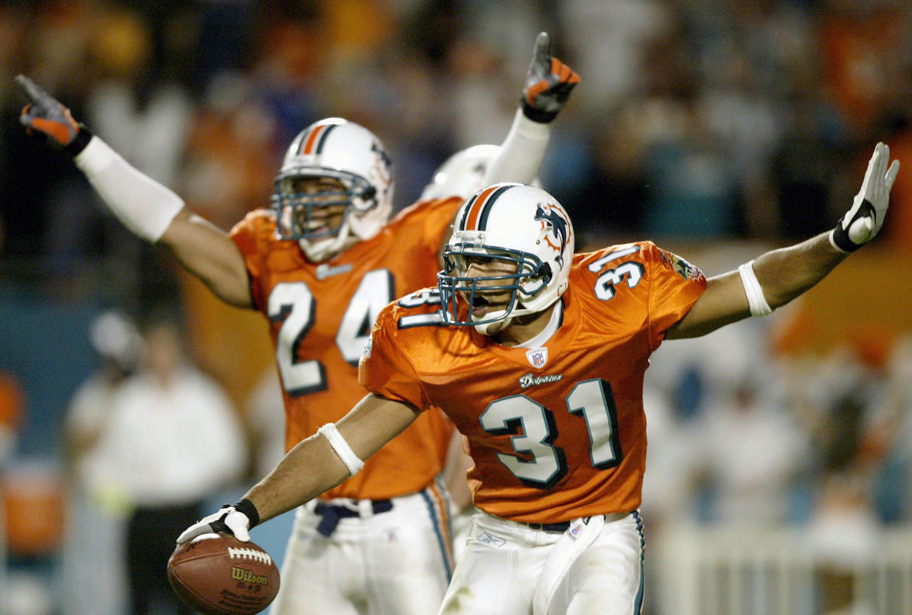 MIAMI - NOVEMBER 23:  Brock Marion #31 of the Miami Dolphins celebrates an interception against the Washington Redskins late in the fourth quarter November 23, 2003 at Pro Player Stadium in Miami, Florida. (Photo by Matthew Stockman/Getty Images)
