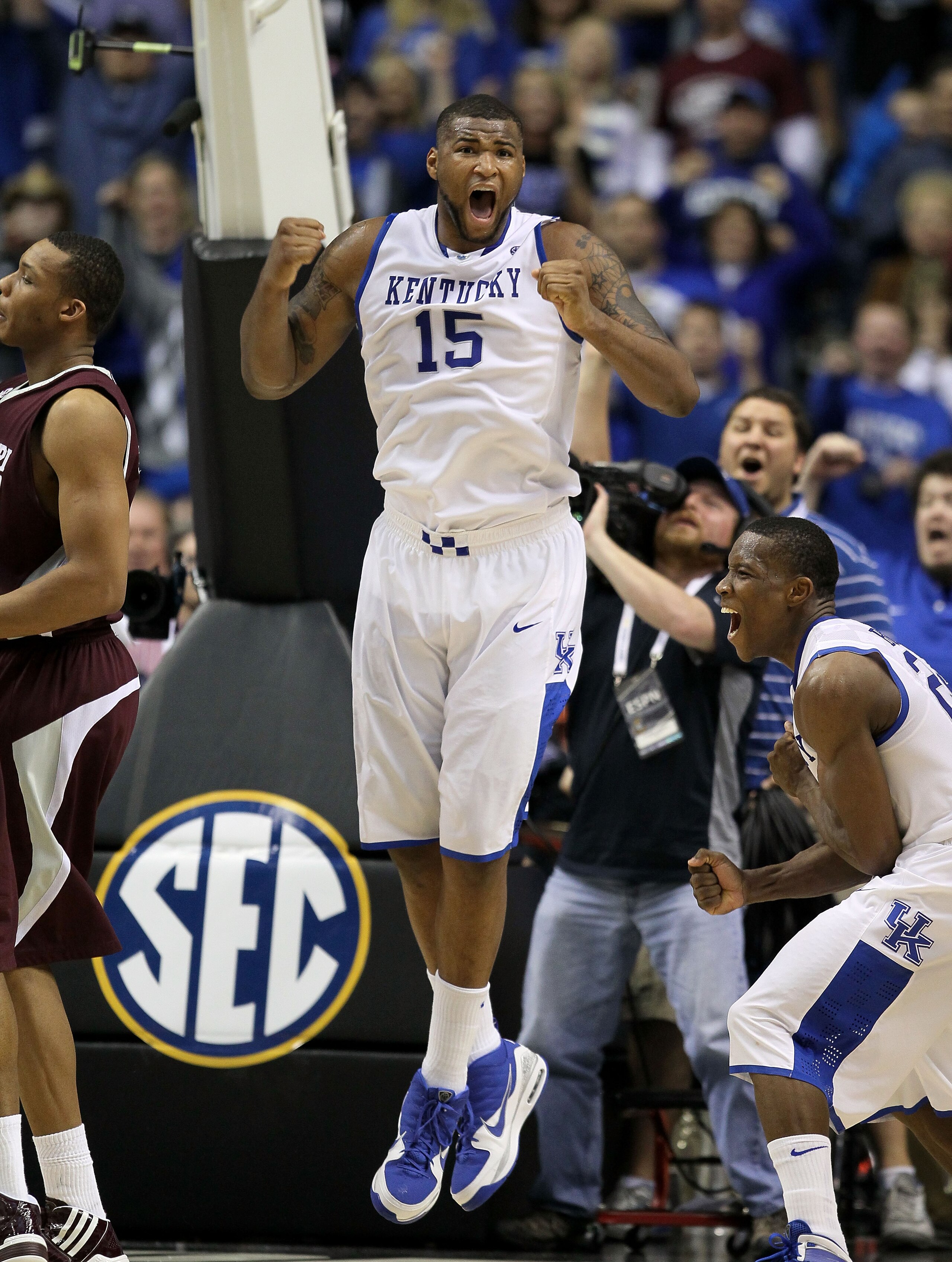 NASHVILLE, TN - MARCH 14:   Eric Bledsoe #24 and DeMarcus Cousins #15 of the Kentucky Wildcats celebrates after Cousins made a 2-point basket at the end of regulation to tie the game and send it to overtime against the Mississippi State Bulldogs during th