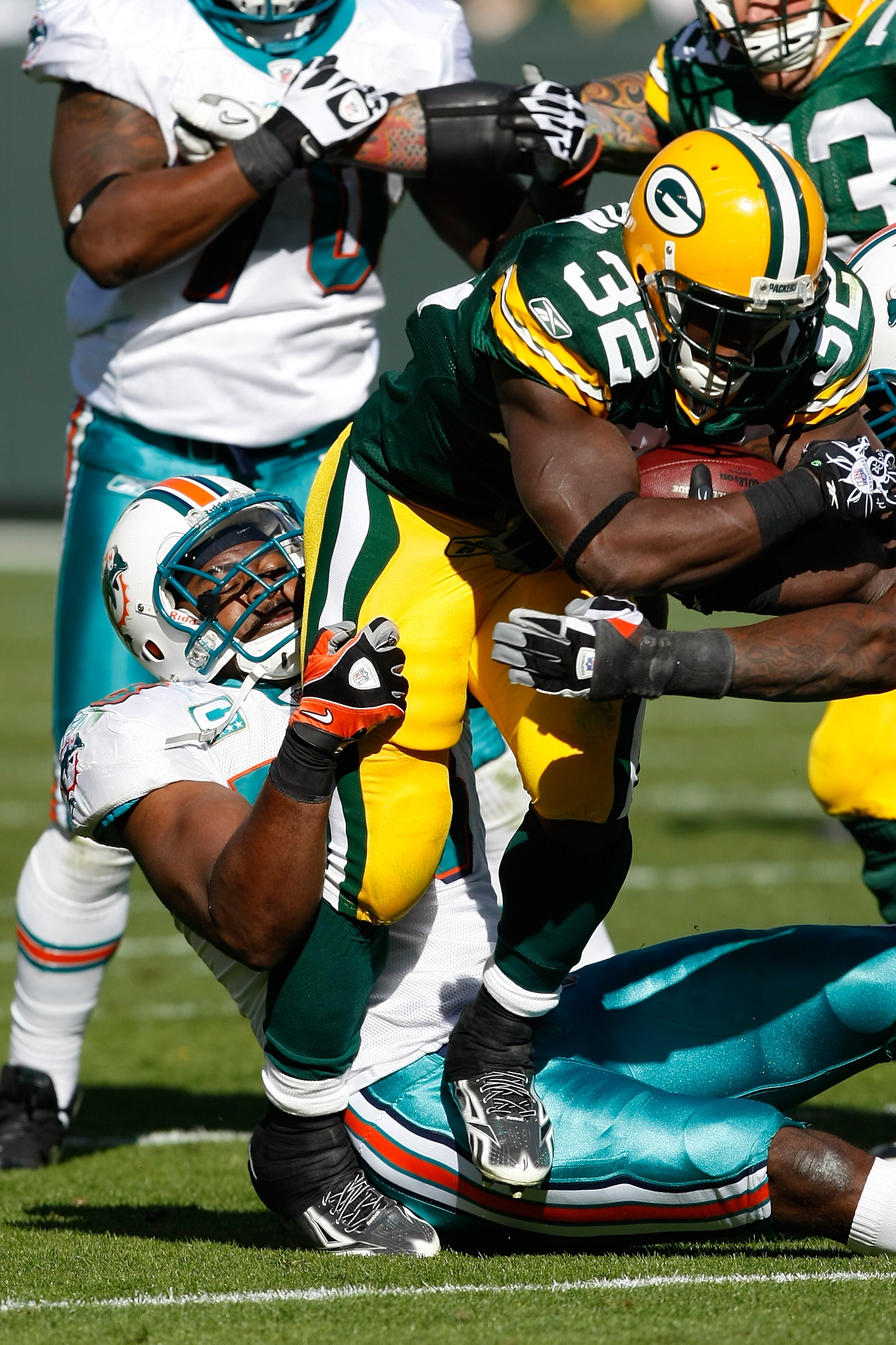 GREEN BAY, WI - OCTOBER 17: Brandon Jackson #32 of the Green Bay Packers runs against the Miami Dolphins at Lambeau Field on October 17, 2010 in Green Bay, Wisconsin. The Dolphins defeated the Packers 23-20 in overtime. (Photo by Scott Boehm/Getty Images)