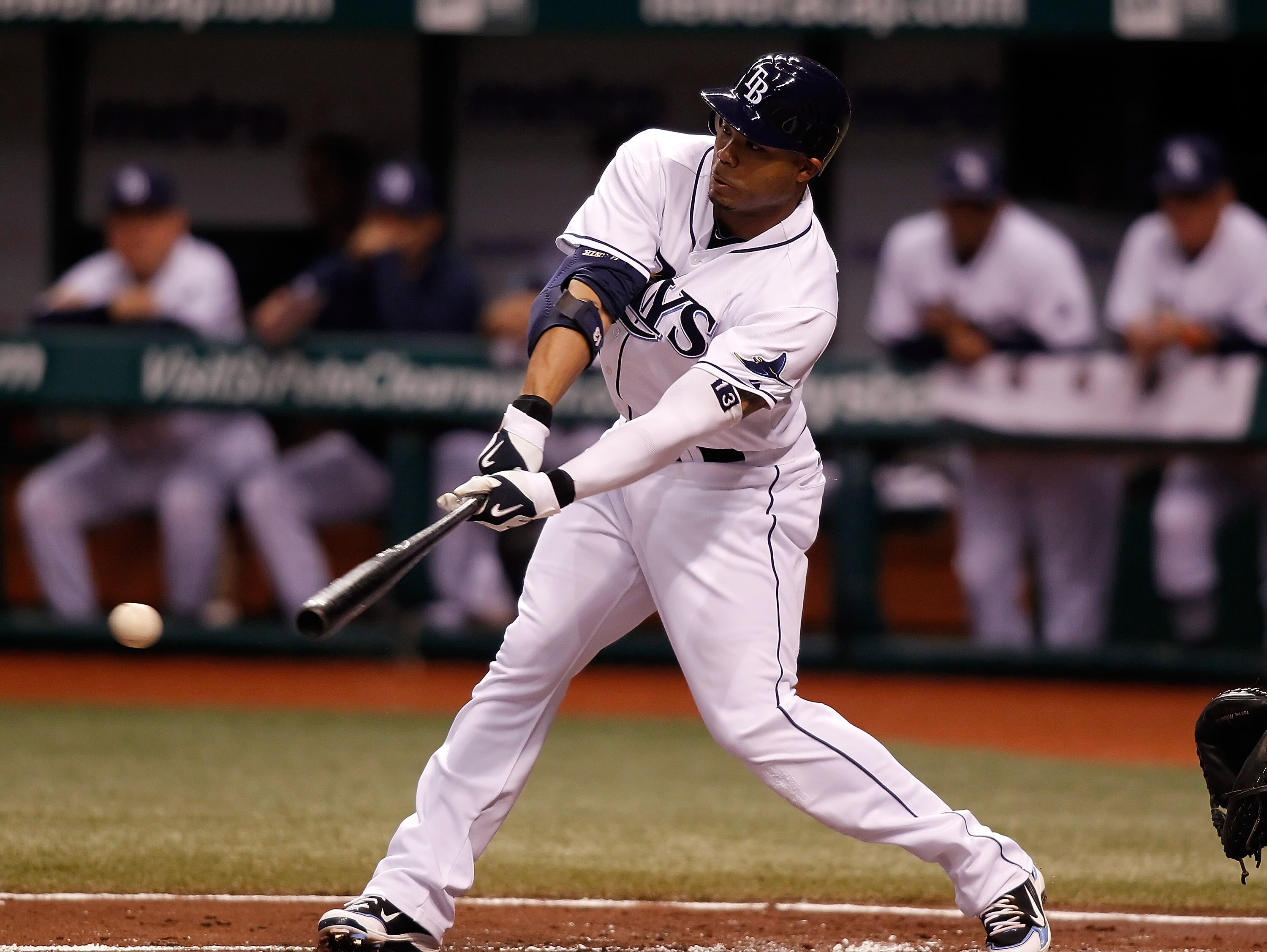 ST. PETERSBURG - SEPTEMBER 27:  Carl Crawford #13 of the Tampa Bay Rays fouls off a pitch against the Baltimore Orioles during the game at Tropicana Field on September 27, 2010 in St. Petersburg, Florida.  (Photo by J. Meric/Getty Images)