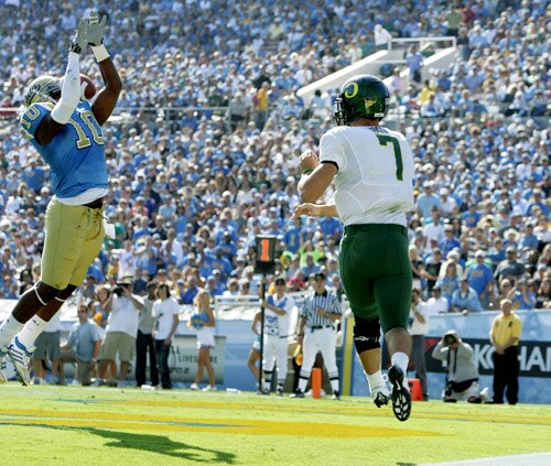 Akeem Ayers leaps for a goal-line pick six in UCLA's last game against Oregon