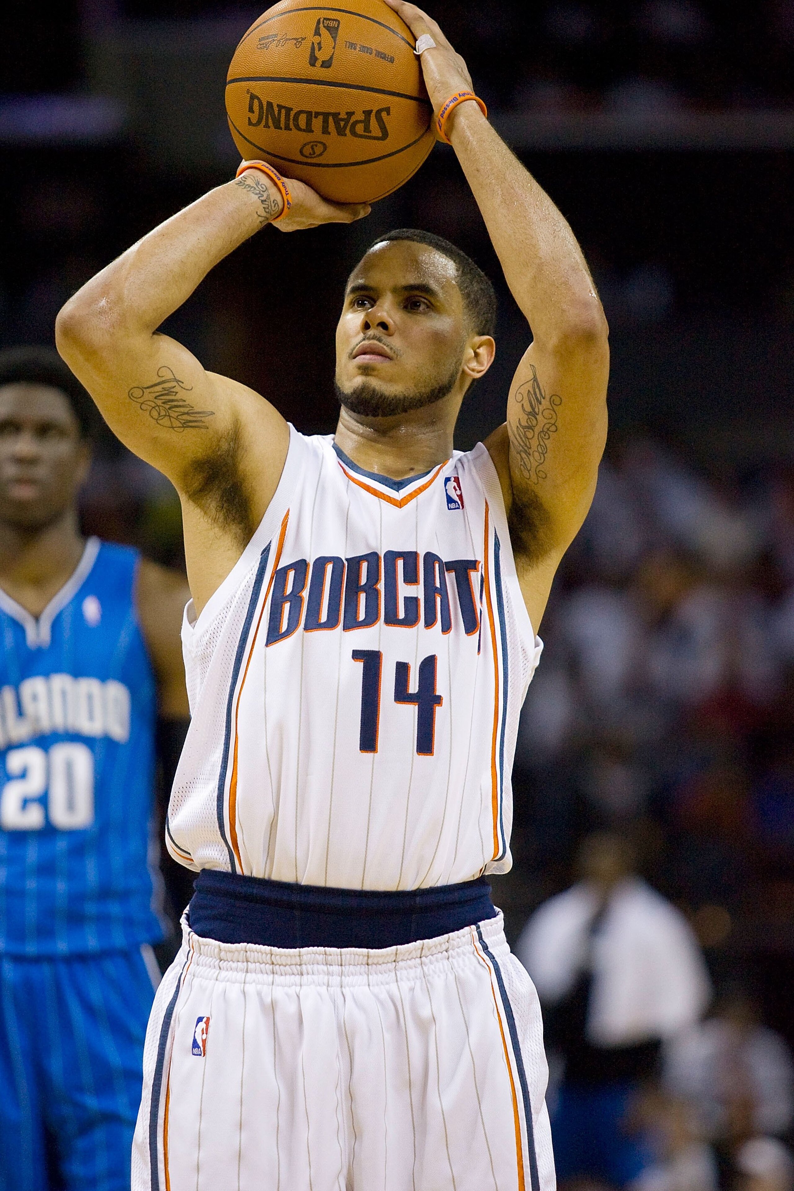 CHARLOTTE, NC - APRIL 26: D.J. Augustin #14 of the Charlotte Bobcats attempts a free throw against the Orlando Magic at Time Warner Cable Arena on April 26, 2010 in Charlotte, North Carolina.  The Magic defeated the Bobcats 99-90 to complete the four game