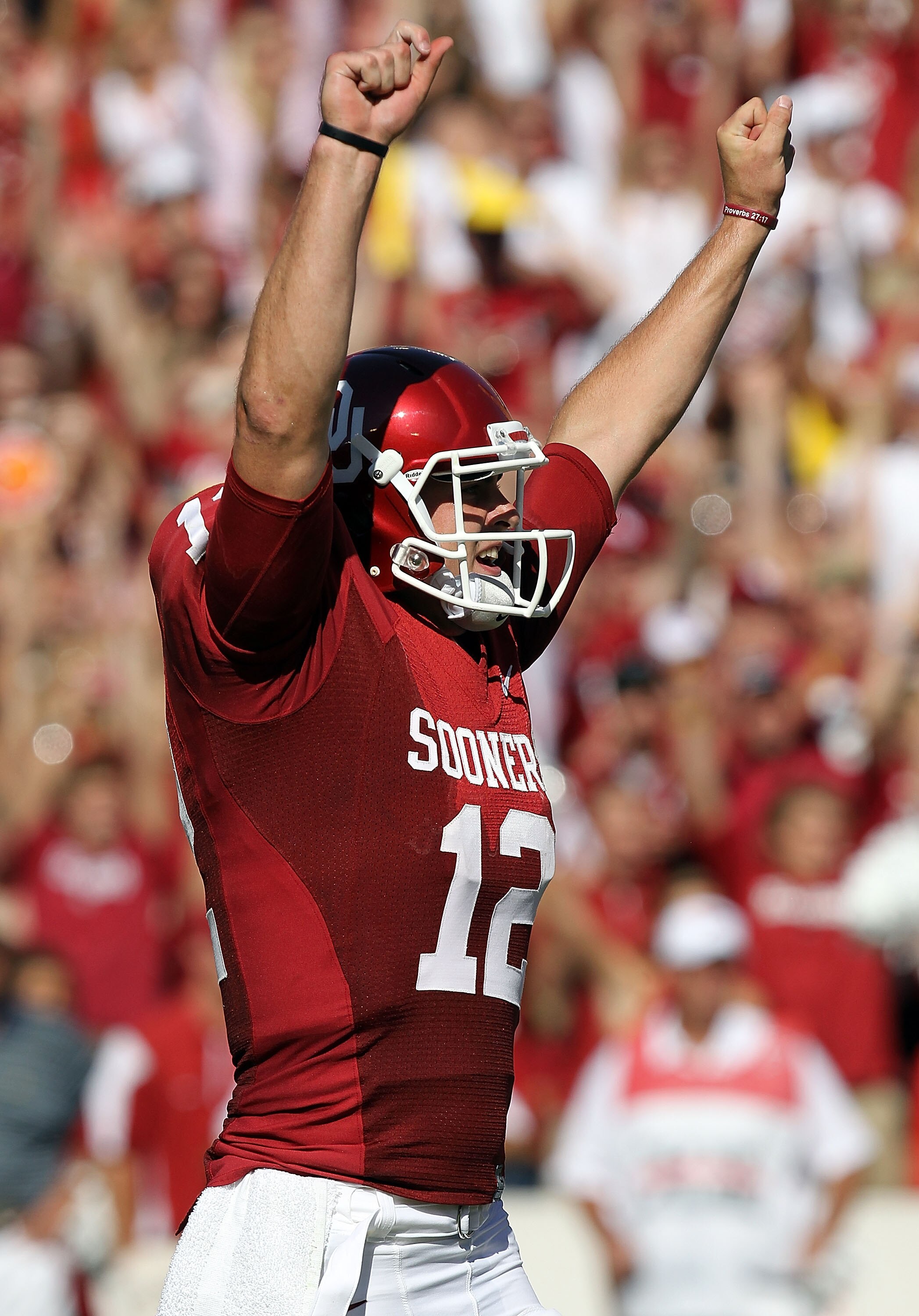 DALLAS - OCTOBER 02:  Quarterback Landry Jones #12 of the Oklahoma Sooners celebrates a touchdown against the Texas Longhorns in the second quarter at the Cotton Bowl on October 2, 2010 in Dallas, Texas.  (Photo by Ronald Martinez/Getty Images)