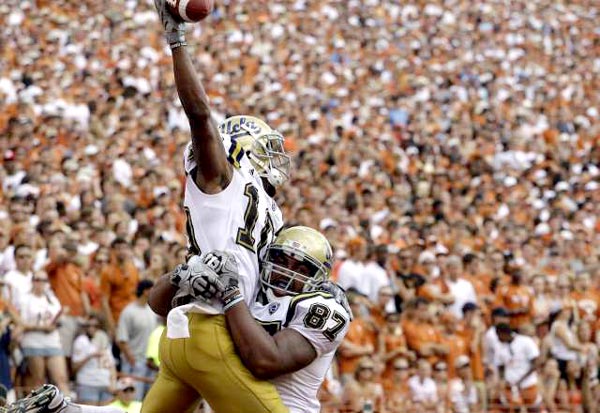 WR Ricky Marvray and TE Corey Harkey celebrate a touchdown in the end zone against Texas
