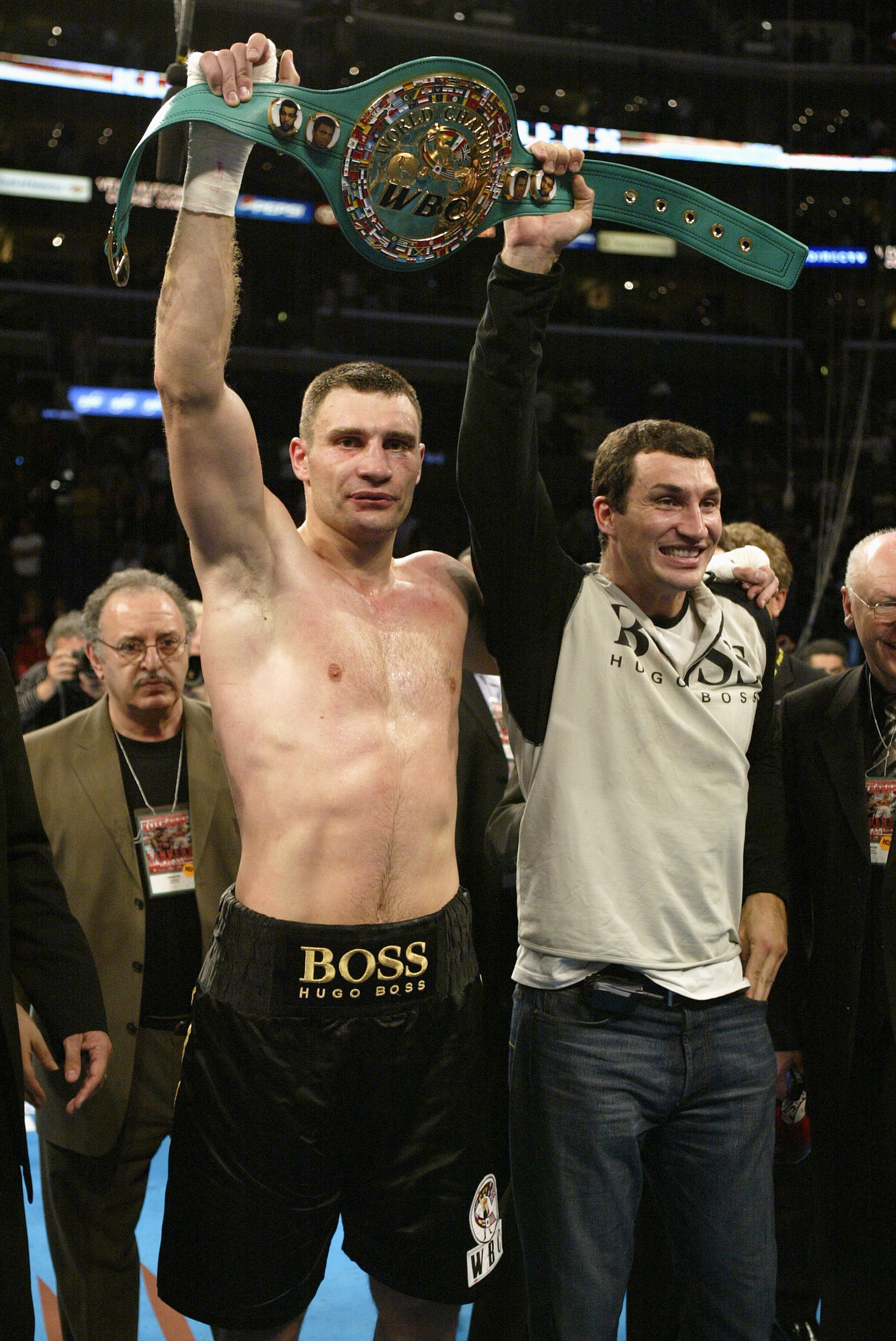LOS ANGELES - APRIL 24:  Ukrainian Vitali Klitschko shows off his WBC belt along with his brother Wladimir after the fight against South African Corrie Sanders on April 24, 2004 at the Staples Center in Los Angeles, California. Klitschko (34-2) defeated S