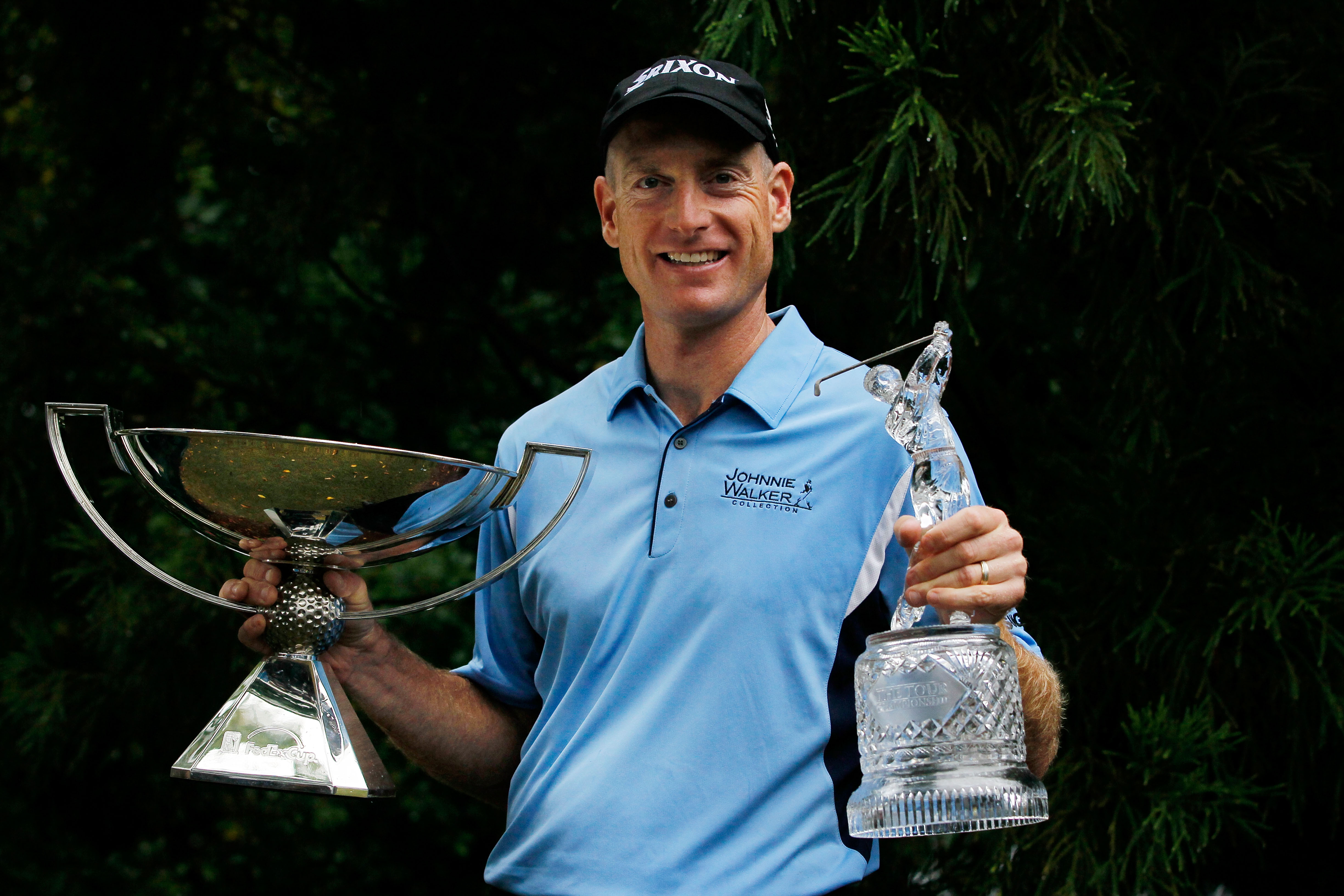 ATLANTA - SEPTEMBER 26:  Jim Furyk celebrates with THE TOUR Championship trophy (R) and the FedExCup Trophy (L) after winning THE TOUR Championship presented by Coca-Cola, the final event of the PGA TOUR Playoffs for the FedExCup, at East Lake Golf Club o