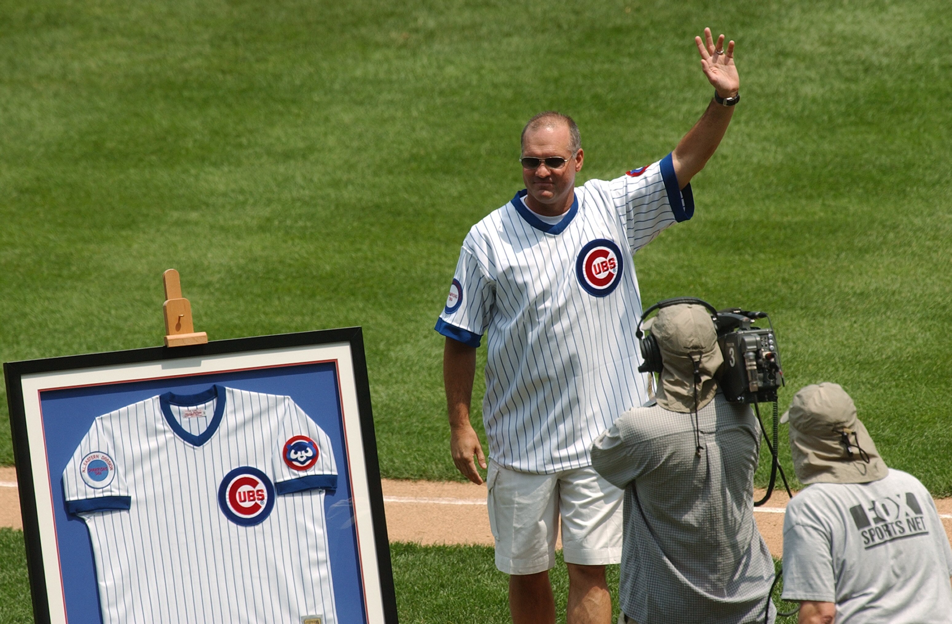 CHICAGO - JUNE 30:  Former Chicago Cubs player Ryne Sandberg acknowledges the fans prior to the game between the Houston Astros and the Chicago Cubs at Wrigley Field on June 30, 2004 in Chicago, Illinois.  The Astros defeated the Cubs 3-2.  (Photo by Jona
