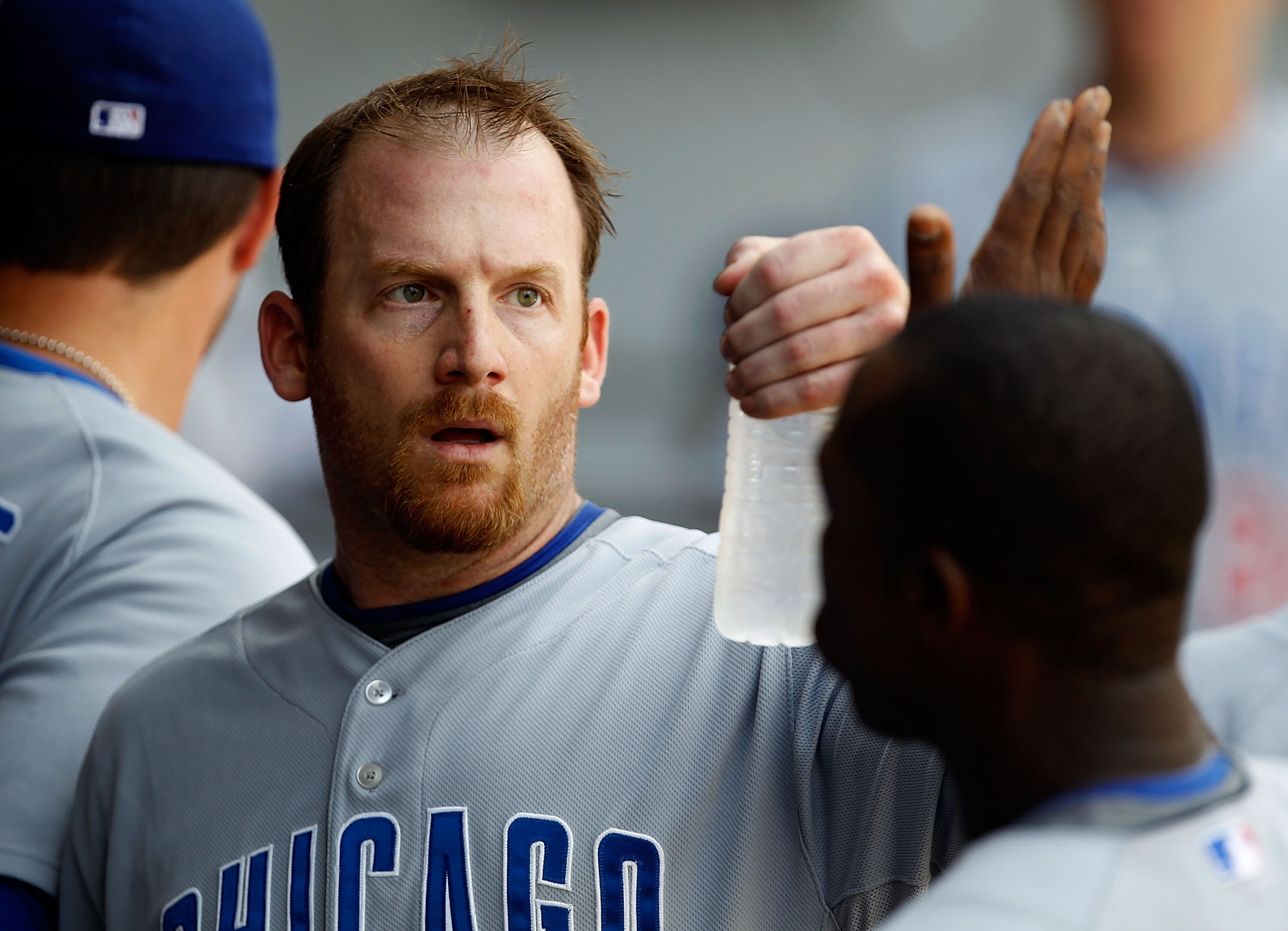 CHICAGO - JUNE 27: Starting pitcher Ryan Dempster #46 of the Chicago Cubs is congratulated by teammates in the dugout after the 7th inning of a game against the Chicago White Sox at U.S. Cellular Field on June 27, 2010 in Chicago, Illinois. The Cubs defea