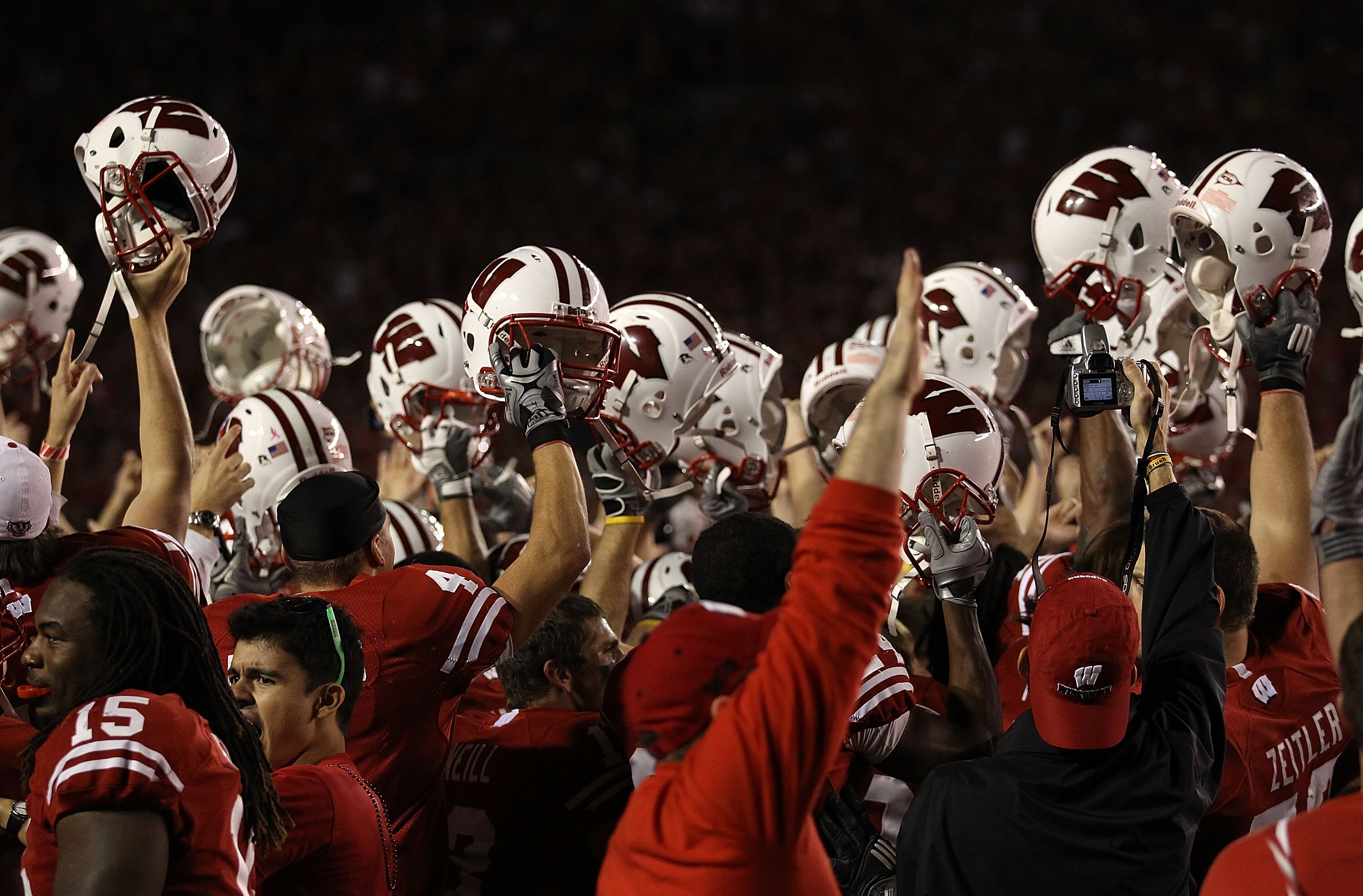 MADISON, WI - OCTOBER 16: Wisconsin Badger players and fans celebrate a win over the Ohio State Buckeyes at Camp Randall Stadium on October 16, 2010 in Madison, Wisconsin. Wisconsin defeated Ohio State 31-18. (Photo by Jonathan Daniel/Getty Images)