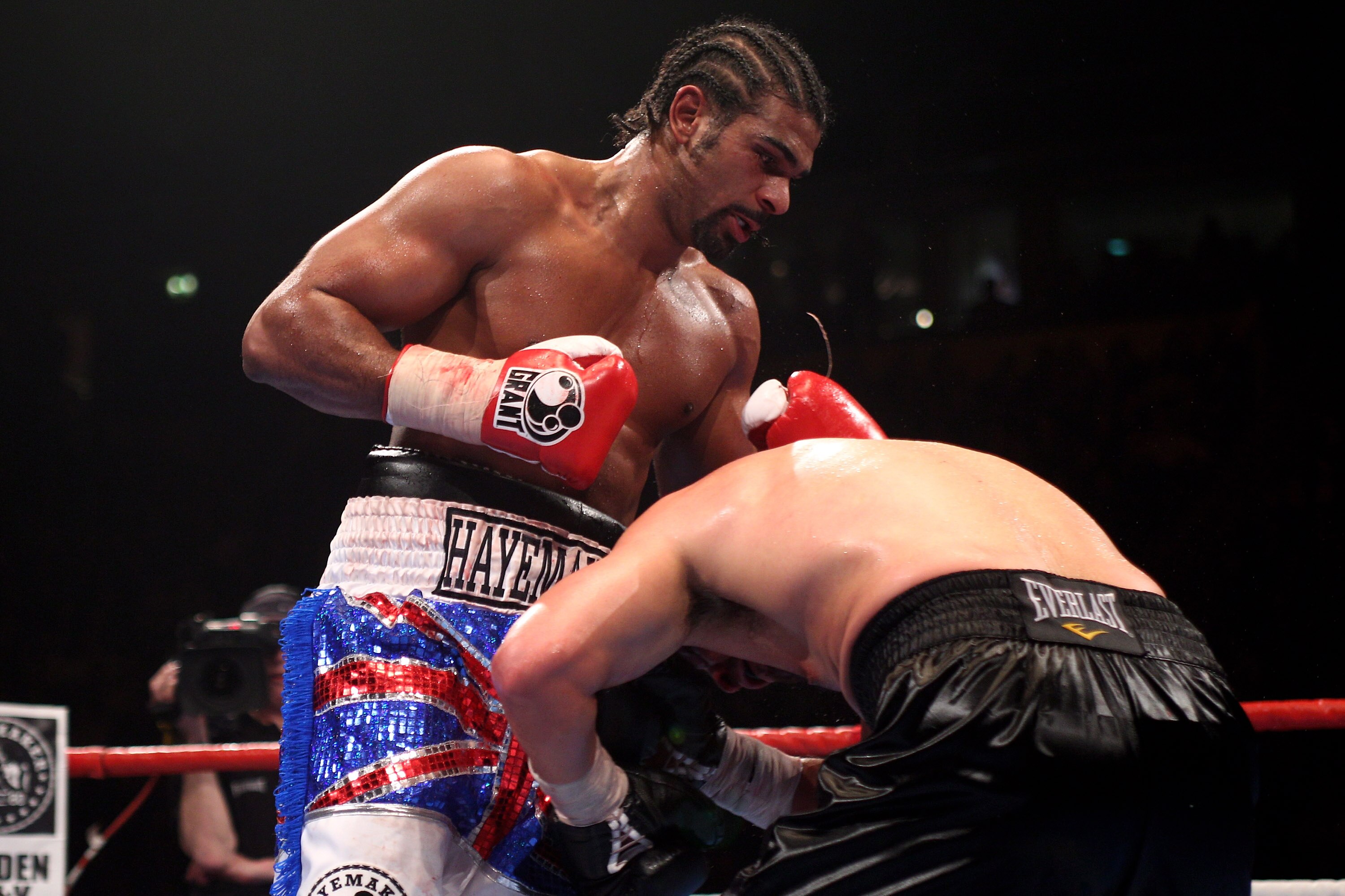 MANCHESTER, ENGLAND - APRIL 03:  David Haye (l) of England punches out as John Ruiz (l) of USA covers up during the World Heavyweight Bout at the MEN Arena on April 3, 2010 in Manchester, England.  (Photo by Michael Steele/Getty Images)