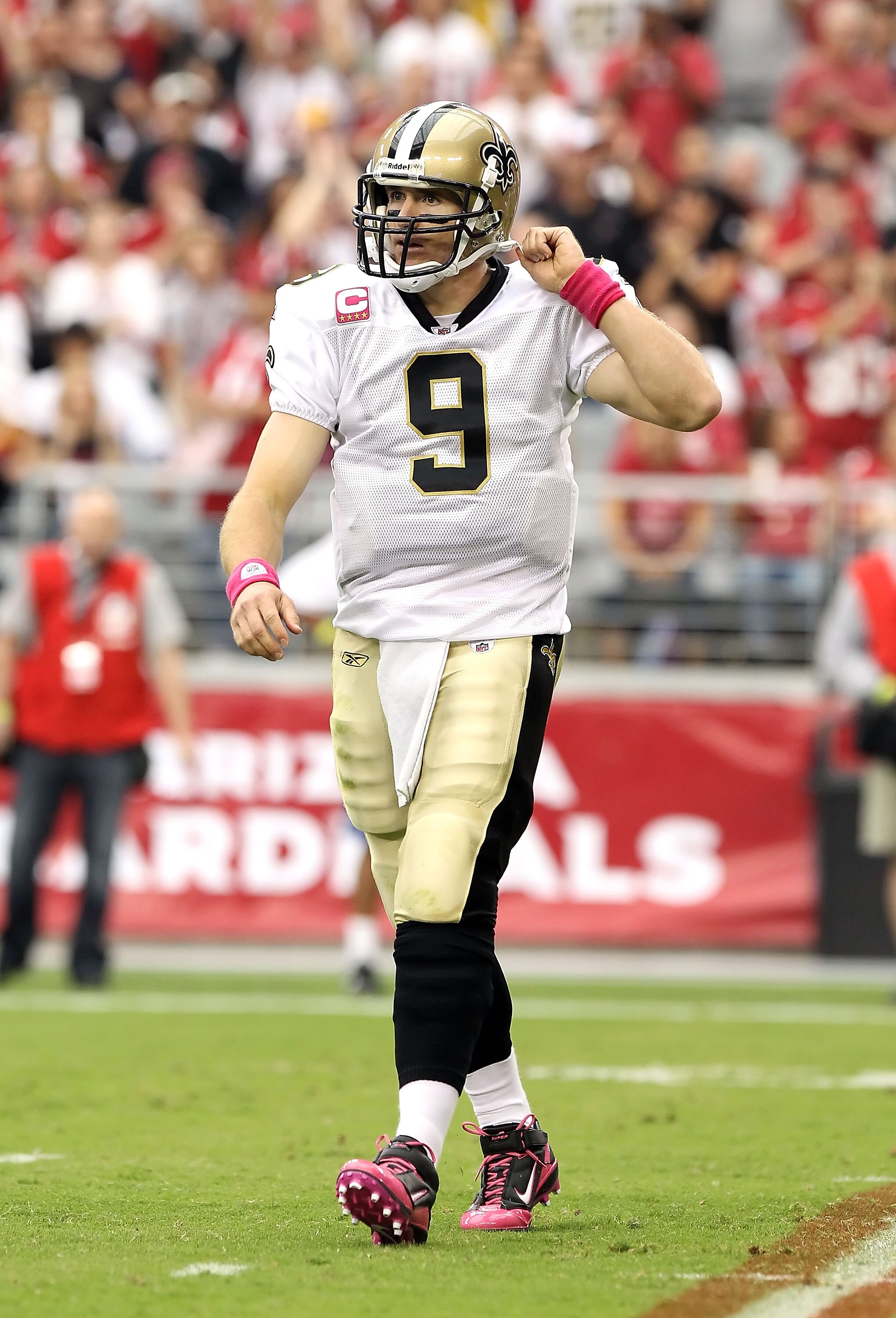 GLENDALE, AZ - OCTOBER 10:  Quarterback Drew Brees #9 of the New Orleans Saints walks on the field during the NFL game against the Arizona Cardinals at the University of Phoenix Stadium on October 10, 2010 in Glendale, Arizona. The Cardinals defeated the