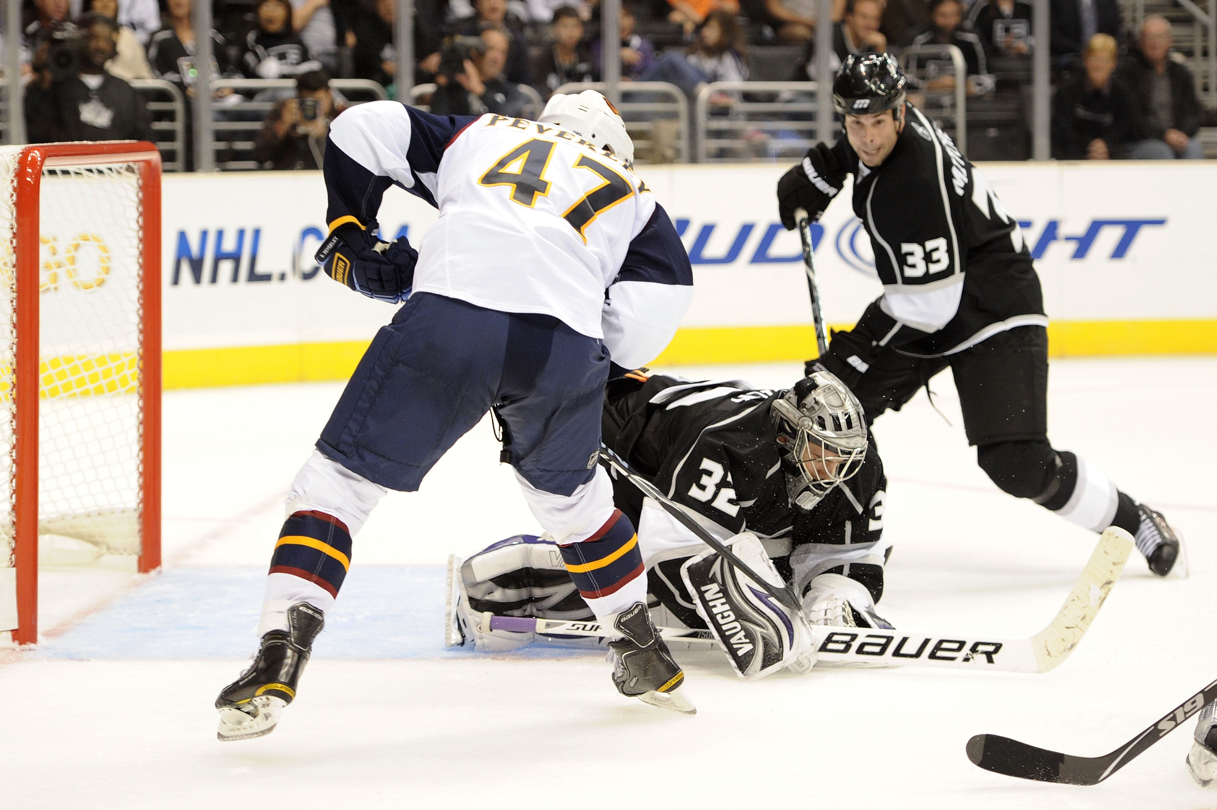 LOS ANGELES, CA - OCTOBER 12: Jonathan Quick #32 of the Los Angeles Kings covers the puck against the Atlanta Thrashers during their game at Staples Center on October 12, 2010 in Los Angeles, California. (Photo by Harry How/Getty Images) LOS ANGELES, CA - OCTOBER 12: Jonathan Quick #32 of the Los Angeles Kings covers the puck against the Atlanta Thrashers during their game at Staples Center on October 12, 2010 in Los Angeles, California. (Photo by Harry How/Getty Images)