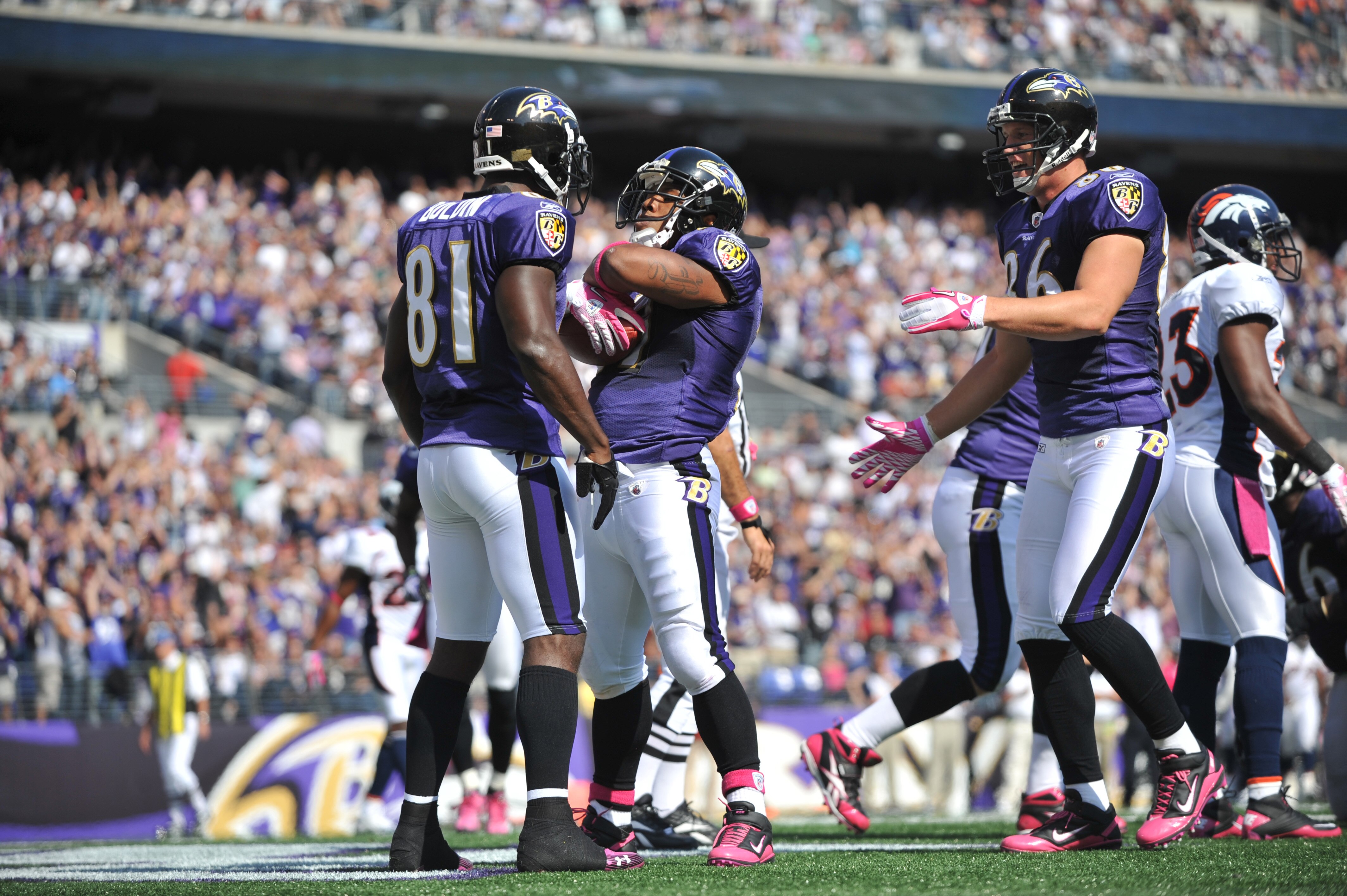 BALTIMORE, MD - OCTOBER 10: Ray Rice #27 of the Baltimore Ravens celebrates a touchdown against the Denver Broncos at M&T Bank Stadium on October 10, 2010 in Baltimore, Maryland. Players wore pink in recognition of Breast Cancer Awareness Month. The Raven