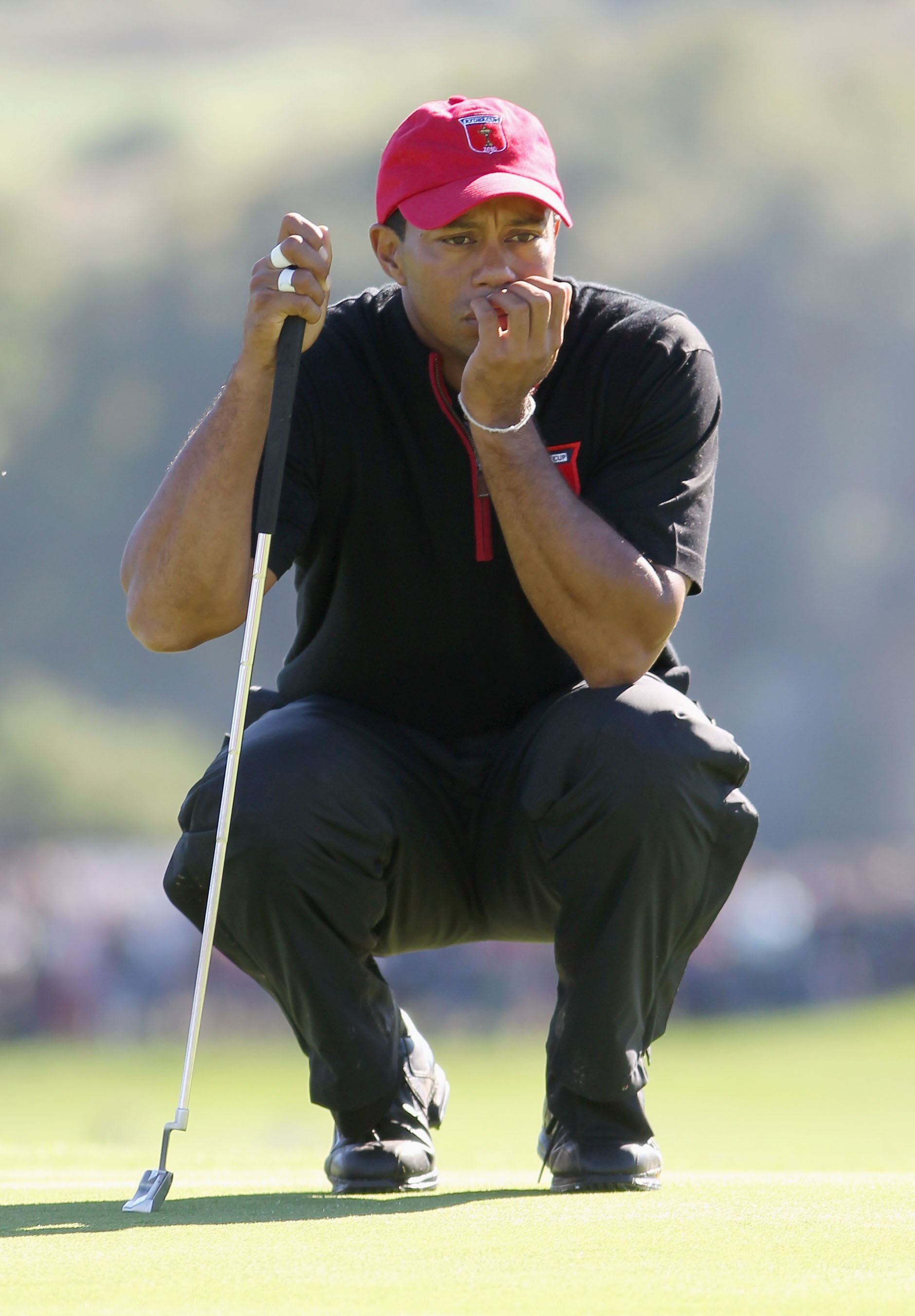 NEWPORT, WALES - OCTOBER 04:  Tiger Woods of the USA lines up a putt in the singles matches during the 2010 Ryder Cup at the Celtic Manor Resort on October 4, 2010 in Newport, Wales.  (Photo by Jamie Squire/Getty Images)