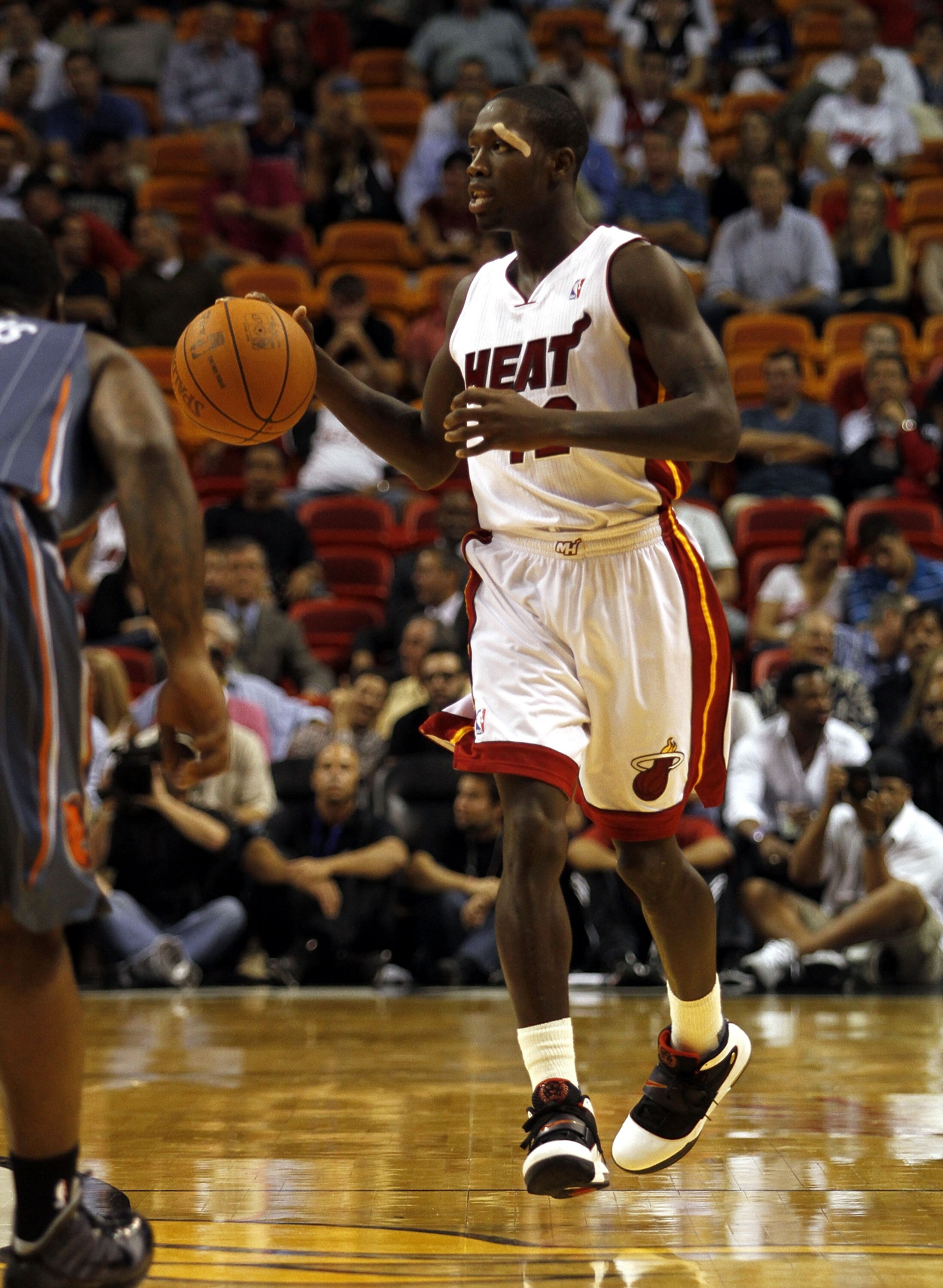 MIAMI - OCTOBER 18:  Guard Patrick Beverley #12  of the Miami Heat brings up the ball against the Charlotte Bobcats on October 18, 2010 at American Airlines Arena in Miami, Florida. NOTE TO USER: User expressly acknowledges and agrees that, by downloading