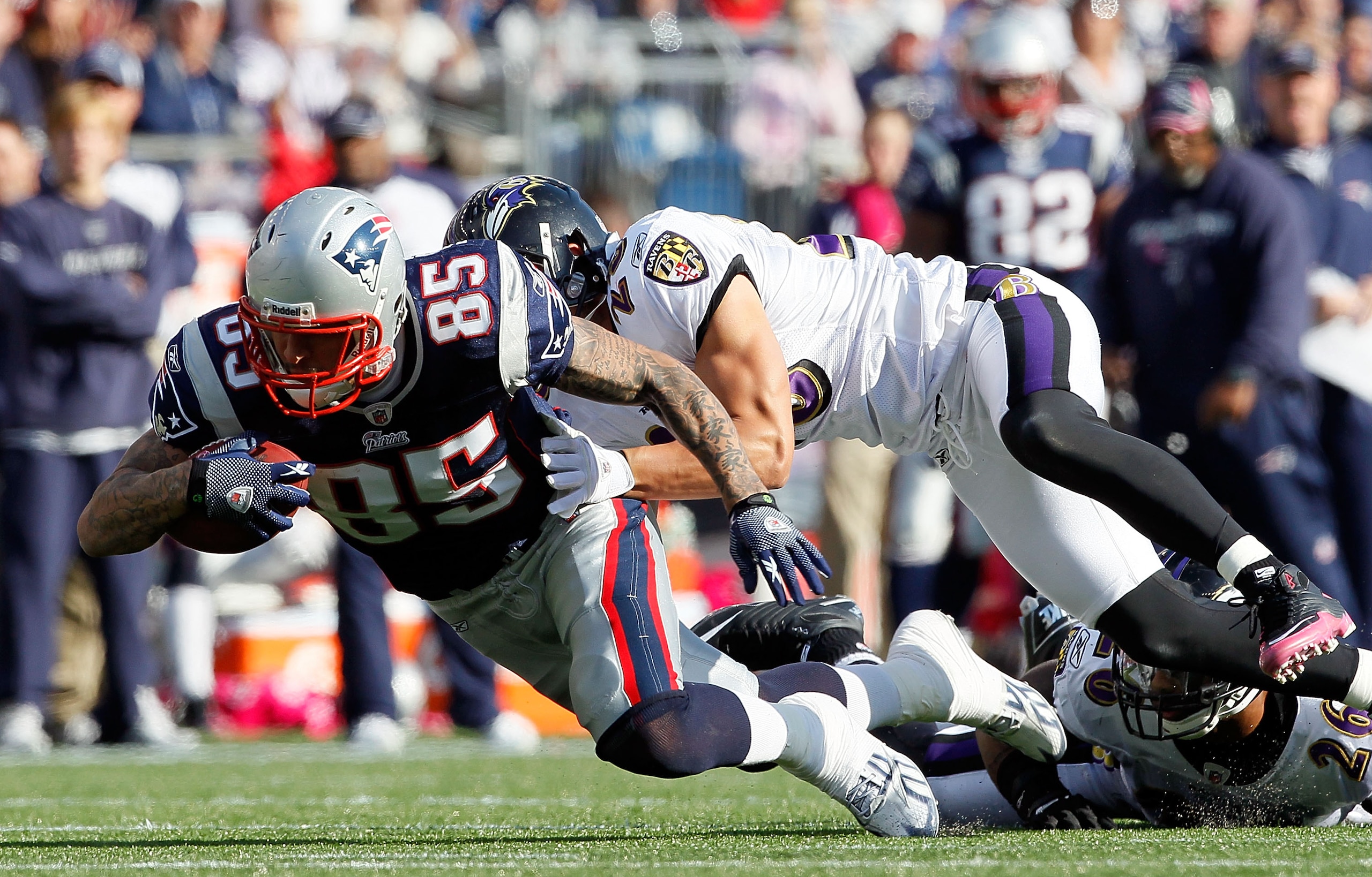 FOXBORO, MA - OCTOBER 17:  Aaron Hernandez #85 of the New England Patriots gains yards against Tom Zbikowski #28 of the Baltimore Ravens in the second half at Gillette Stadium on October 17, 2010 in Foxboro, Massachusetts. The Patriot won 23-20 in overtim