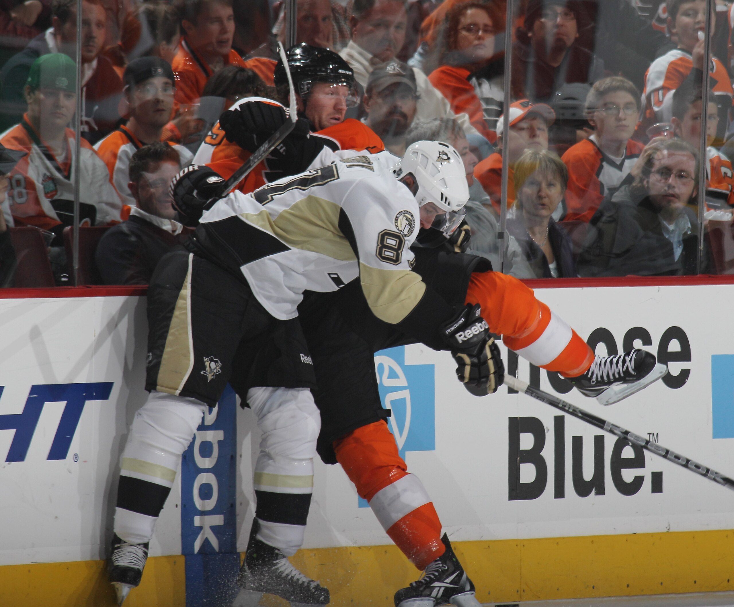 PHILADELPHIA - OCTOBER 16: Sidney Crosby #87 of the Pittsburgh Penguins hits Scott Hartnell #19 of the Philadelphia Flyers at the Wells Fargo Center on October 16, 2010 in Philadelphia, Pennsylvania.  (Photo by Bruce Bennett/Getty Images)