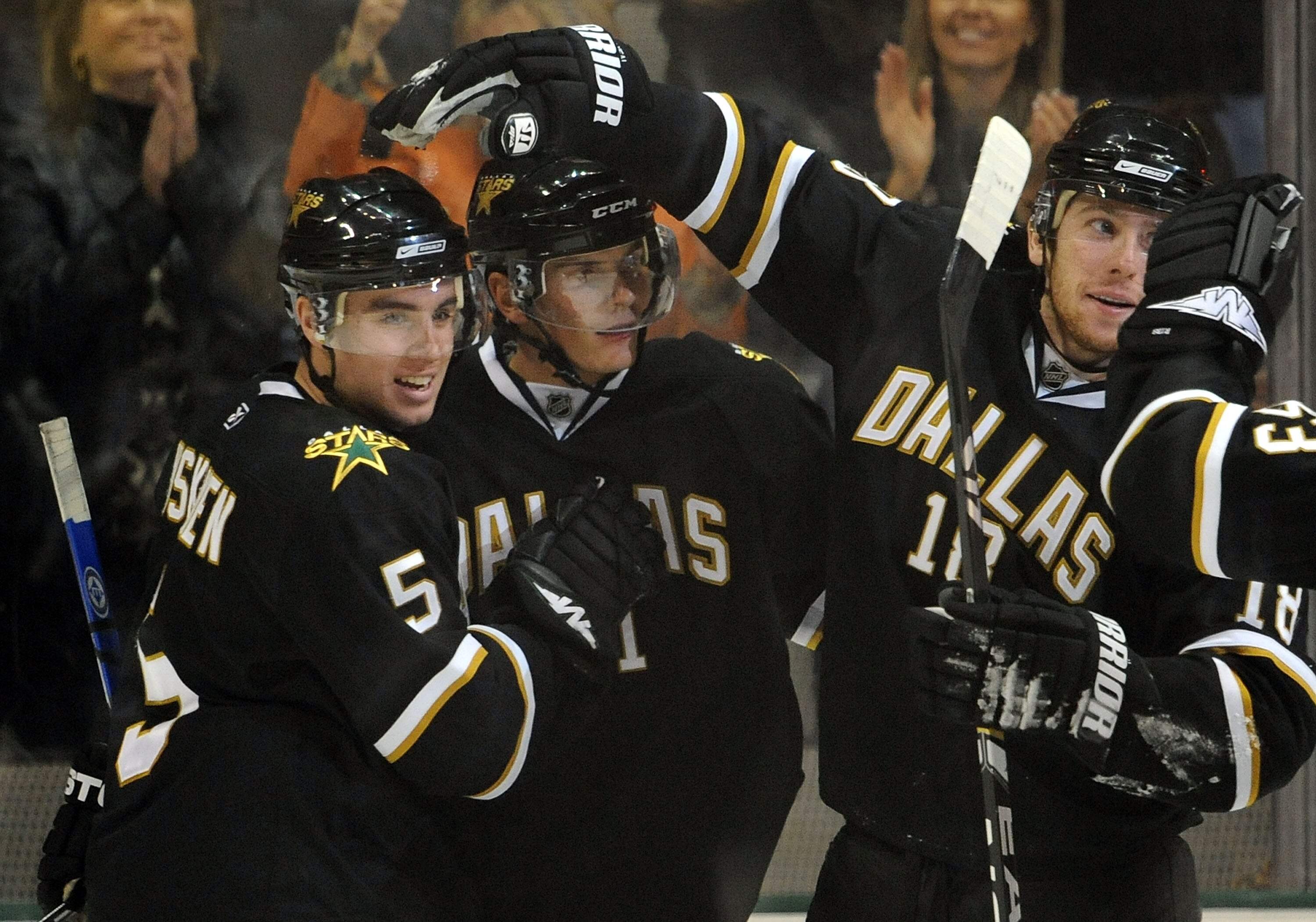 DALLAS - FEBRUARY 03:  (L-R) Matt Niskanen #5, Loui Eriksson #21 and James Neal #18 of the Dallas Stars celebrate a goal against the Calgary Flames in the second period at the American Airlines Center on February 3, 2009 in Dallas, Texas.  (Photo by Ronal