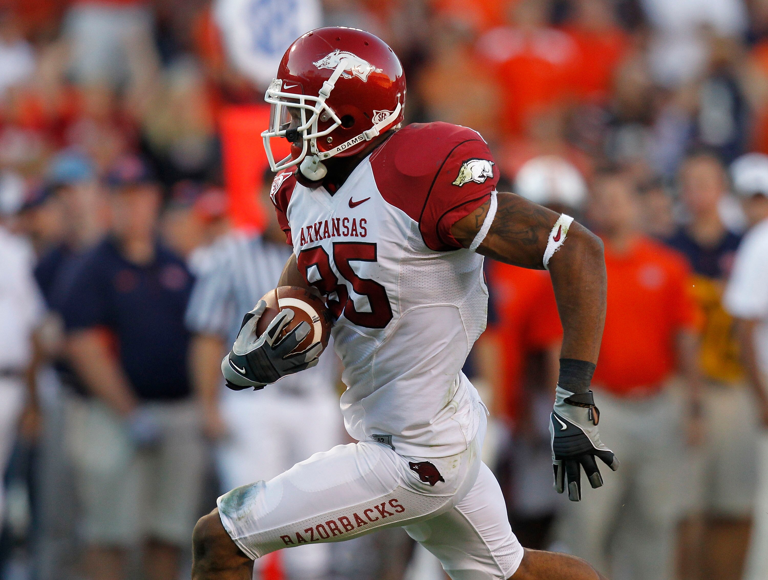 AUBURN - OCTOBER 16: Wide receiver Greg Childs #85 of the Arkansas Razorbacks makes a reception and runs for a touchdown in the fourth quarter during the game against the Auburn Tigers at Jordan-Hare Stadium on October 16, 2010 in Auburn, Alabama. The T AUBURN - OCTOBER 16: Wide receiver Greg Childs #85 of the Arkansas Razorbacks makes a reception and runs for a touchdown in the fourth quarter during the game against the Auburn Tigers at Jordan-Hare Stadium on October 16, 2010 in Auburn, Alabama. The T