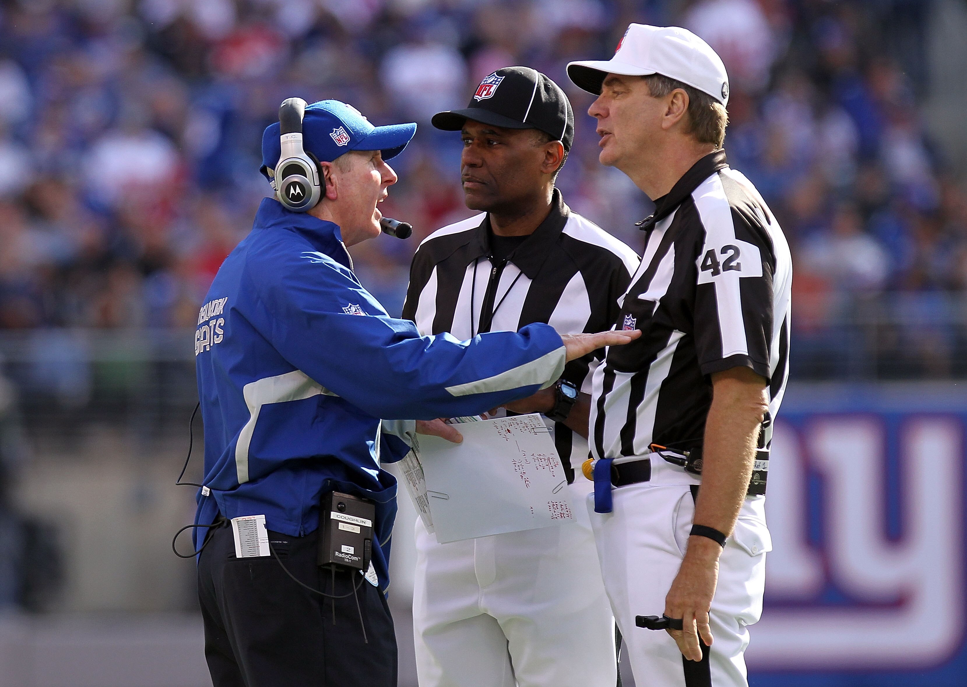 EAST RUTHERFORD, NJ - OCTOBER 17:  Head coach  of the New York Giants, Tom Coughlin talks to referee Jeff Triplette #42 against the Detroit Lions at New Meadowlands Stadium on October 17, 2010 in East Rutherford, New Jersey.  (Photo by Nick Laham/Getty Im
