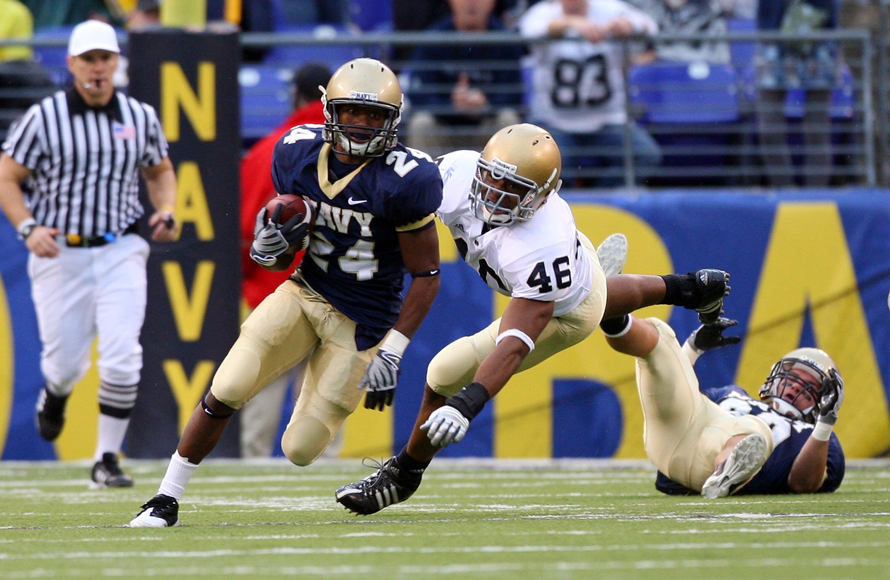 BALTIMORE - NOVEMBER 15:  Corey James #24 of the Navy Midshipmen returns a punt past Steve Filer #46 of the Notre Dame Fighting Irish on November 15, 2008 at M&T Bank Stadium in Baltimore, Maryland. Notre Dame defeated Navy 27-21.  (Photo by Jim McIsaac/G