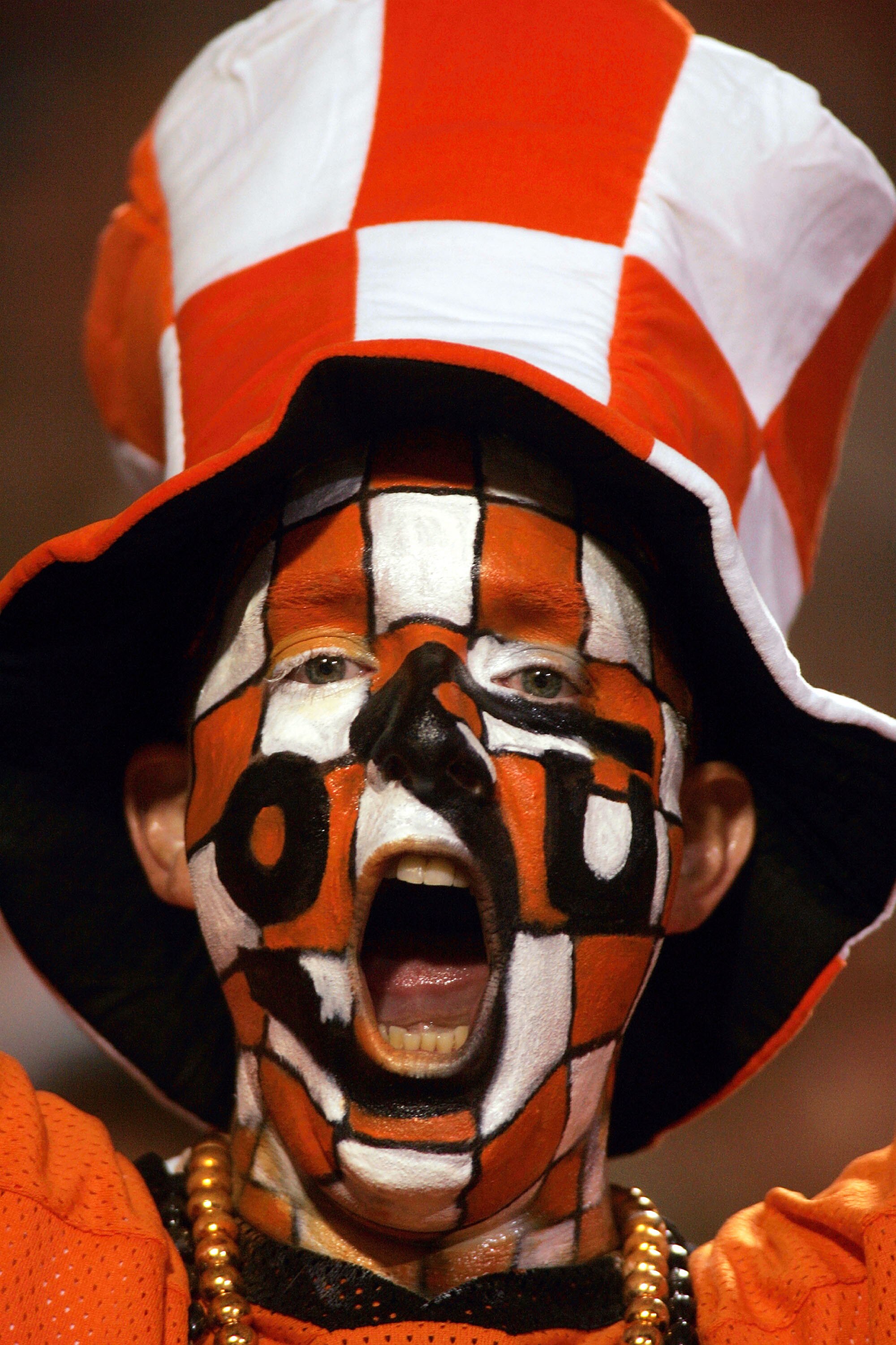STILLWATER, OK - OCTOBER 29:  An Oklahoma State Cowboys fan with face paint cheers during play against the Texas Longhorns October 29, 2005 at Boone Pickens Stadium in Stillwater, Oklahoma.  (Photo by Ronald Martinez/Getty Images)