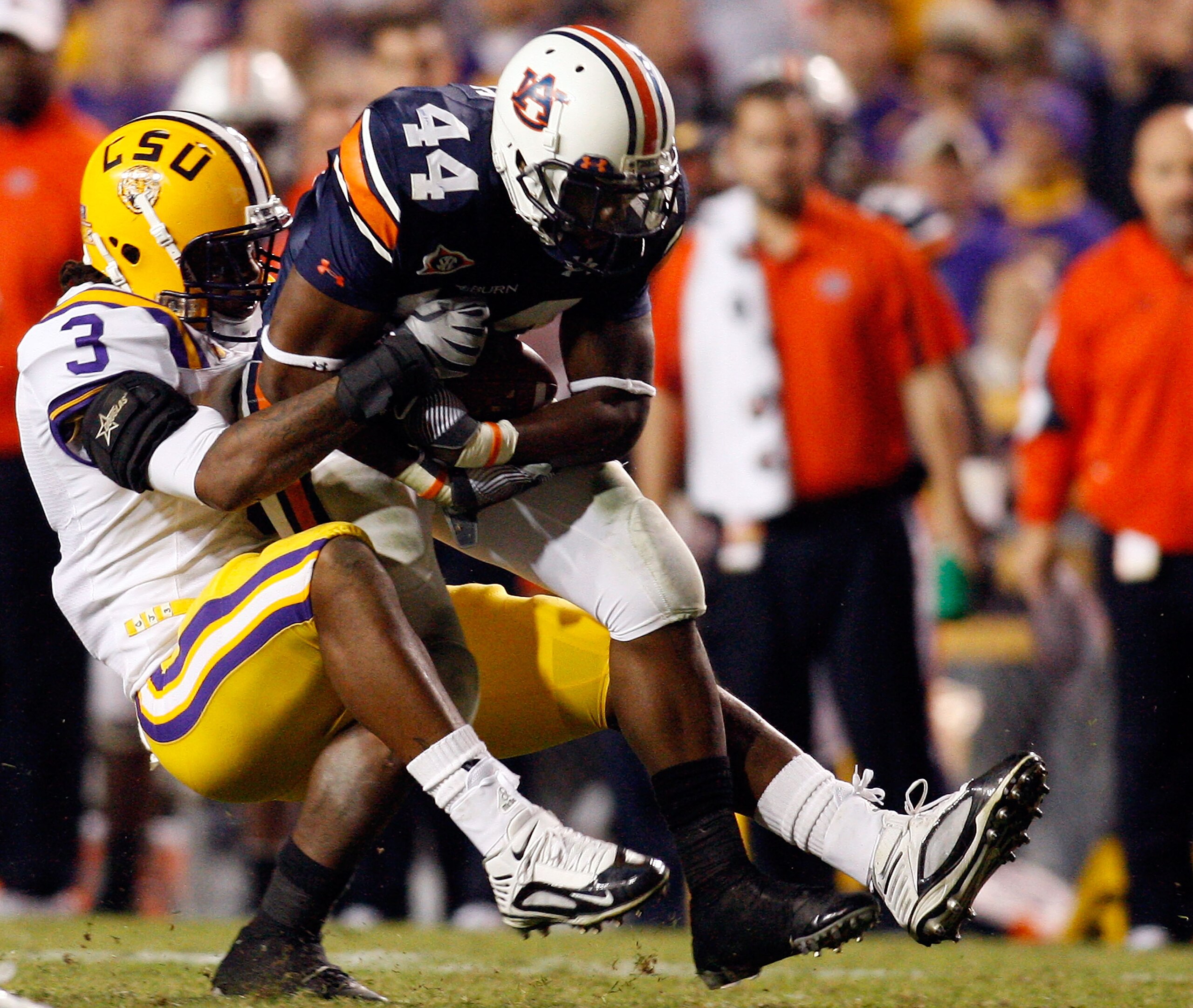 BATON ROUGE, LA - OCTOBER 24: Ben Tate #44 of the Auburn Tigers is tackled by Chad Jones #3 of the Louisiana State University Tigers at Tiger Stadium on October 24, 2009 in Baton Rouge, Louisiana. (Photo by Chris Graythen/Getty Images) BATON ROUGE, LA - OCTOBER 24: Ben Tate #44 of the Auburn Tigers is tackled by Chad Jones #3 of the Louisiana State University Tigers at Tiger Stadium on October 24, 2009 in Baton Rouge, Louisiana. (Photo by Chris Graythen/Getty Images)