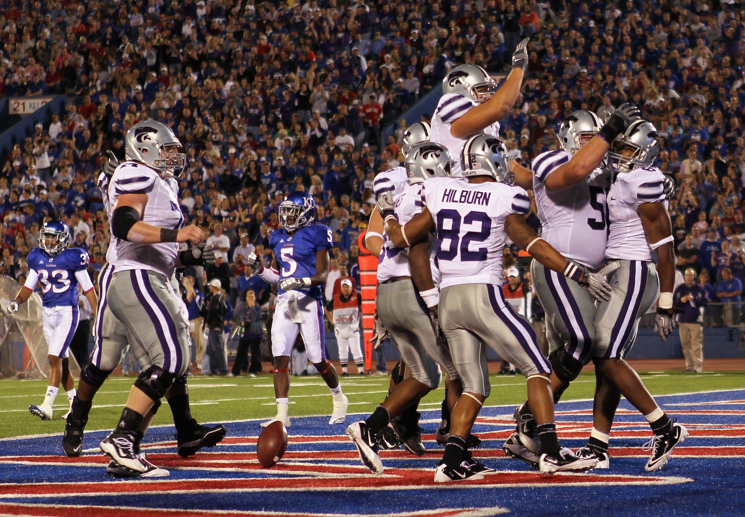 LAWRENCE, KS - OCTOBER 14: Daniel Thomas #8 of the Kansas State Wildcats is congratulated by teammates after scoring a touchdown during the game against the Kansas Jayhawks on October 14, 2010 at Memorial Stadium in Lawrence, Kansas. (Photo by Jamie Squ LAWRENCE, KS - OCTOBER 14: Daniel Thomas #8 of the Kansas State Wildcats is congratulated by teammates after scoring a touchdown during the game against the Kansas Jayhawks on October 14, 2010 at Memorial Stadium in Lawrence, Kansas. (Photo by Jamie Squ