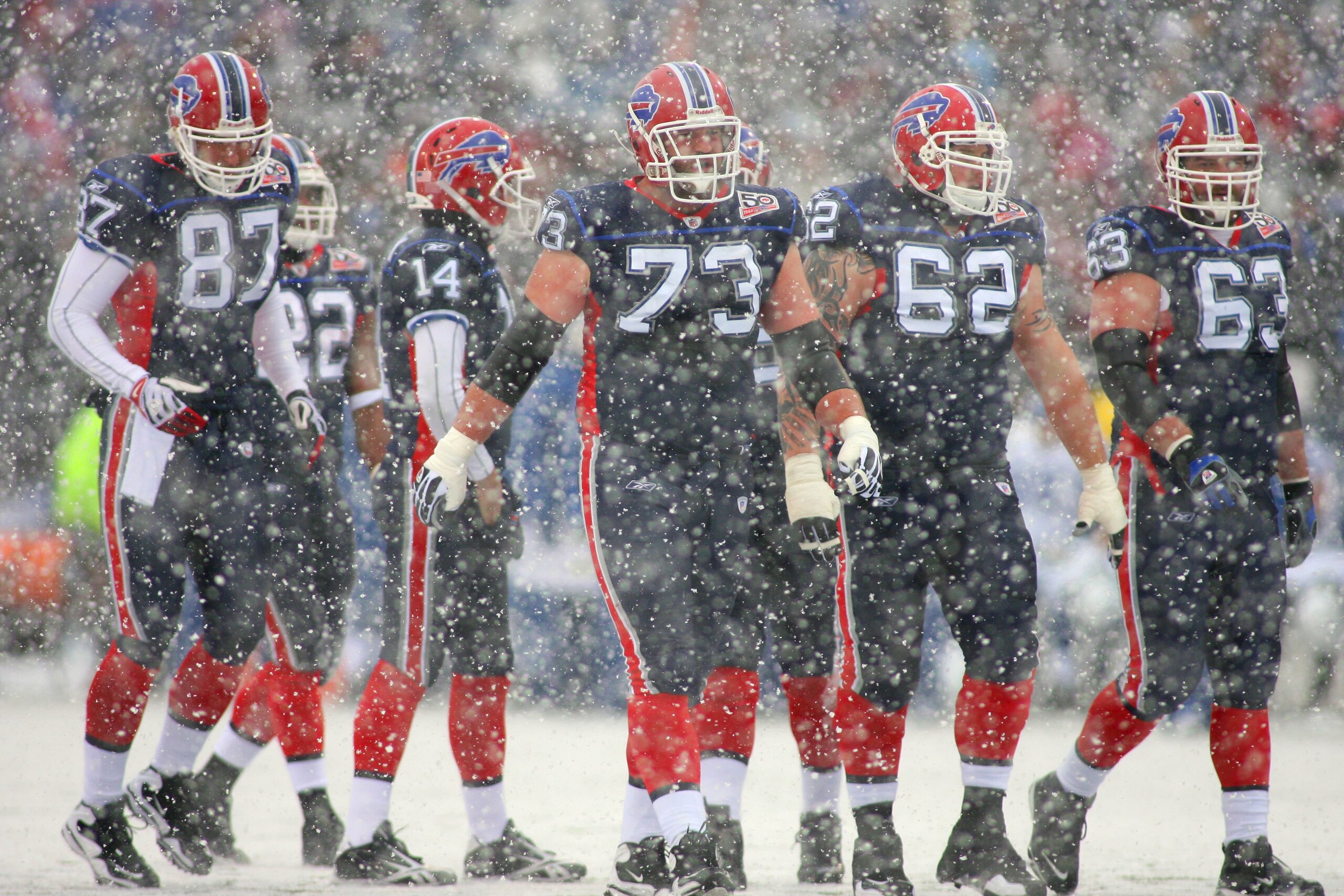 ORCHARD PARK, NY - JANUARY 3: (L-R) Joe Klopfenstein #87, Kirk Chambers #73, Richie Incognito #62 and Geoff Hangartner #63 of the Buffalo Bills look on as snow falls on the field during a break in play in their NFL game against the Indianapolis Colts at R