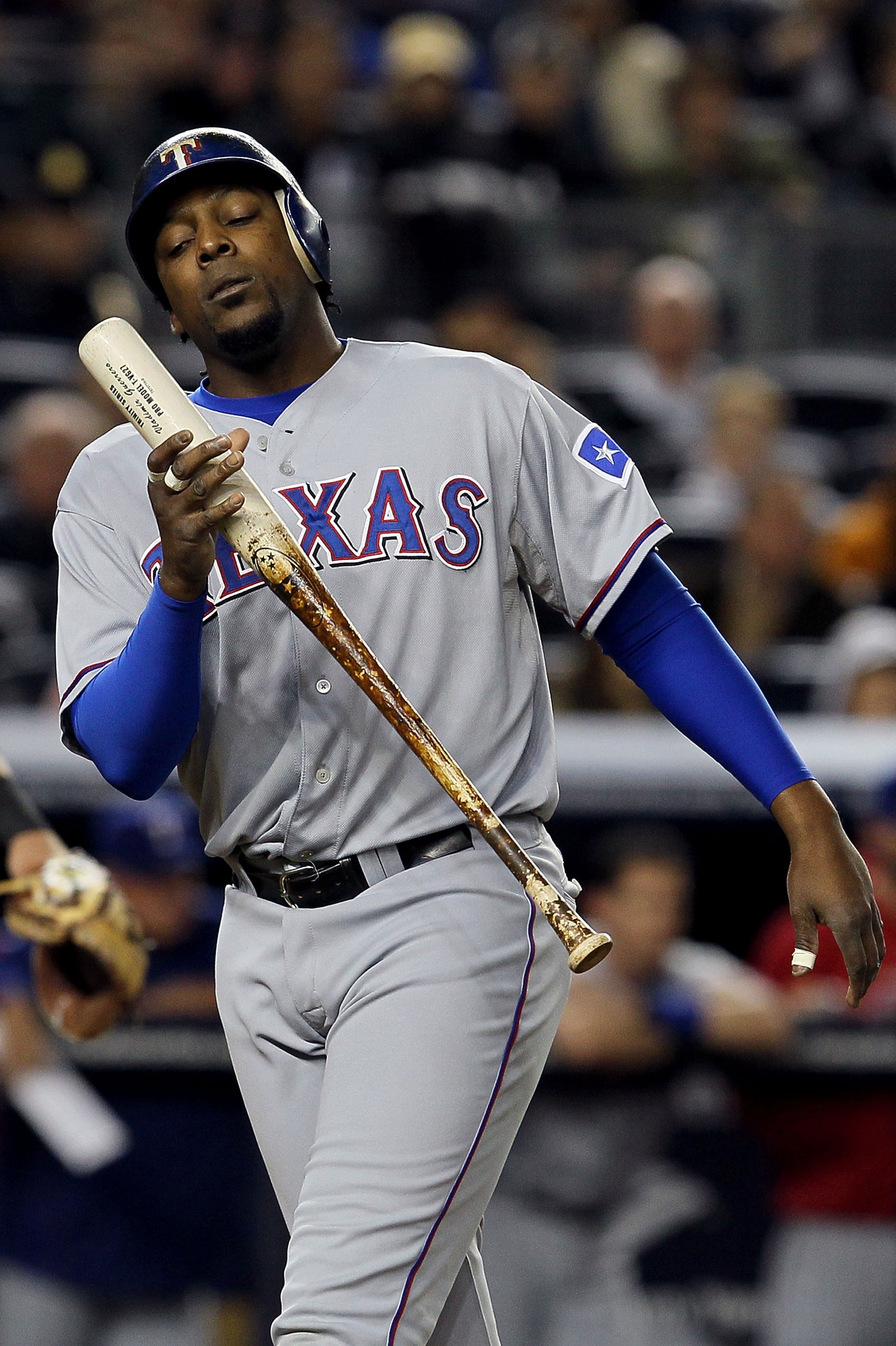 NEW YORK - OCTOBER 19:  Vladimir Guerrero #27 of the Texas Rangers reacts after striking out against the New York Yankees in Game Four of the ALCS during the 2010 MLB Playoffs at Yankee Stadium on October 19, 2010 in the Bronx borough of New York City.  (