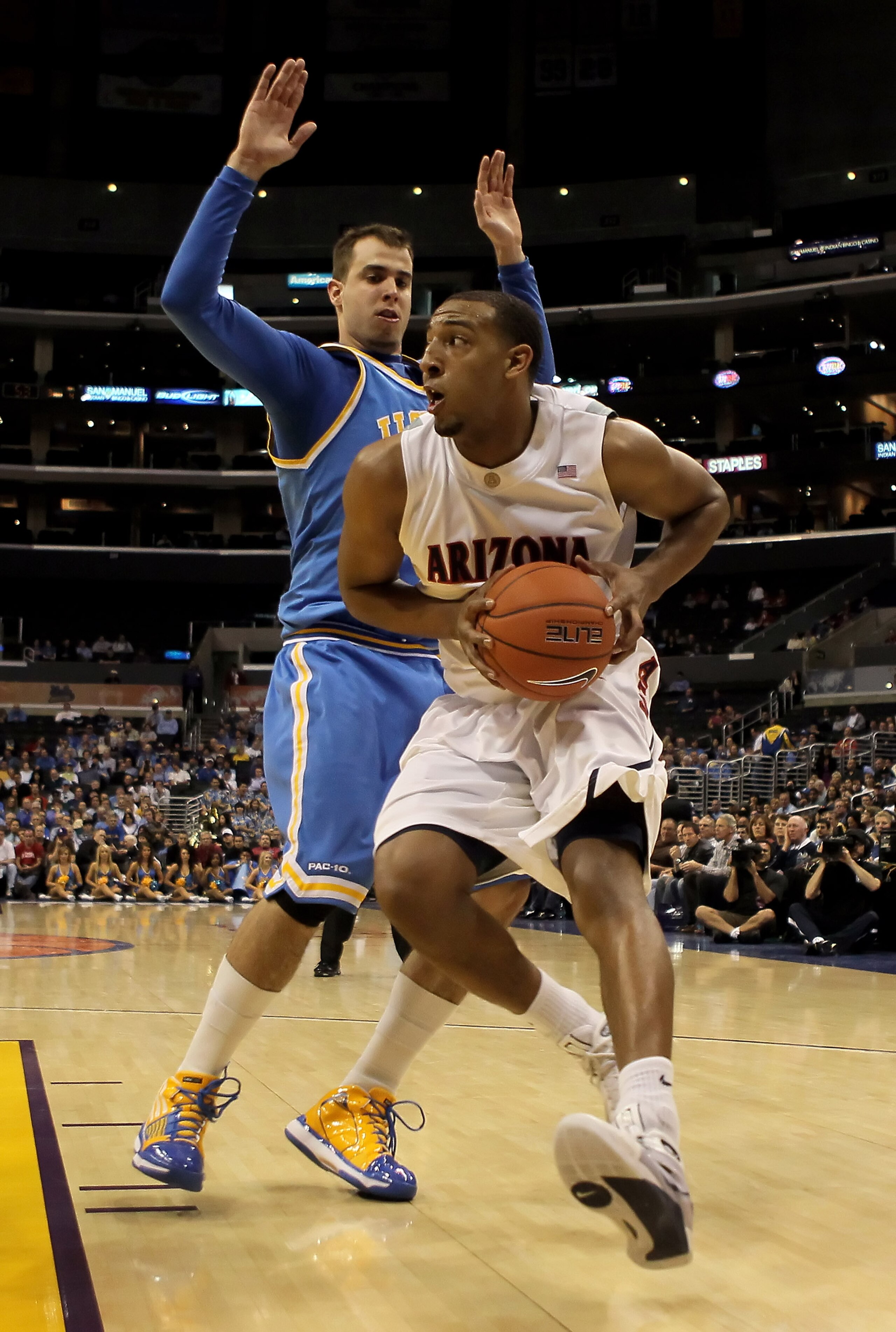 LOS ANGELES, CA - MARCH 11: Derrick Williams #23 of the Arizona Wildcats is defended by Nikola Dragovic #41 of the UCLA Bruins in the second half during the Quarterfinals of the Pac-10 Basketball Tournament at Staples Center on March 11, 2010 in Los Ange LOS ANGELES, CA - MARCH 11: Derrick Williams #23 of the Arizona Wildcats is defended by Nikola Dragovic #41 of the UCLA Bruins in the second half during the Quarterfinals of the Pac-10 Basketball Tournament at Staples Center on March 11, 2010 in Los Ange