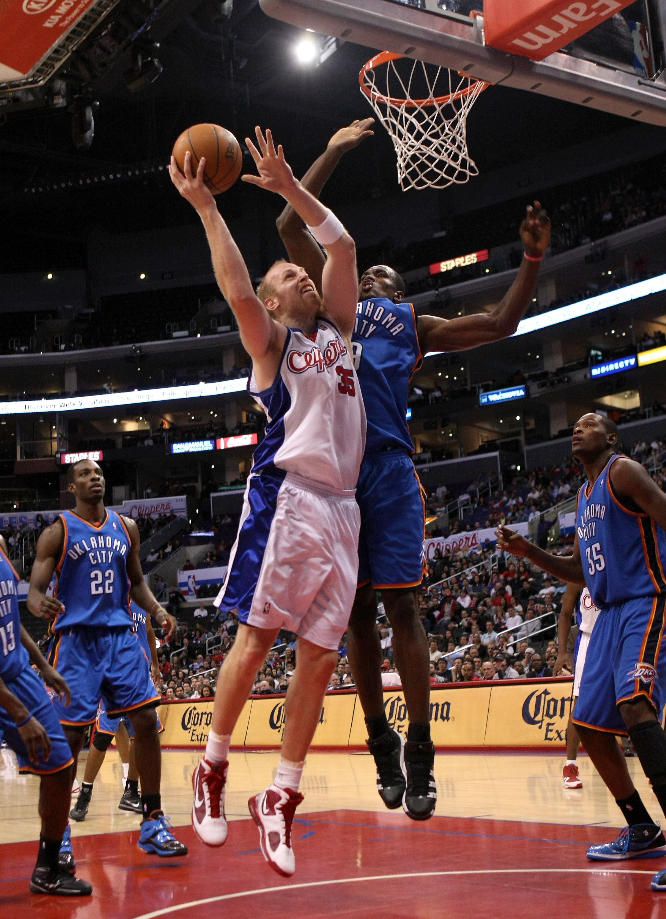LOS ANGELES, CA - NOVEMBER 11:  Chris Kaman #35 of the Los Angeles Clippers shoots over Serge Ibaka #9 of the Oklahoma City Thunder on November 11, 2009 at Staples Center in Los Angeles, California.  The Thunder won 83-79.   NOTE TO USER: User expressly a