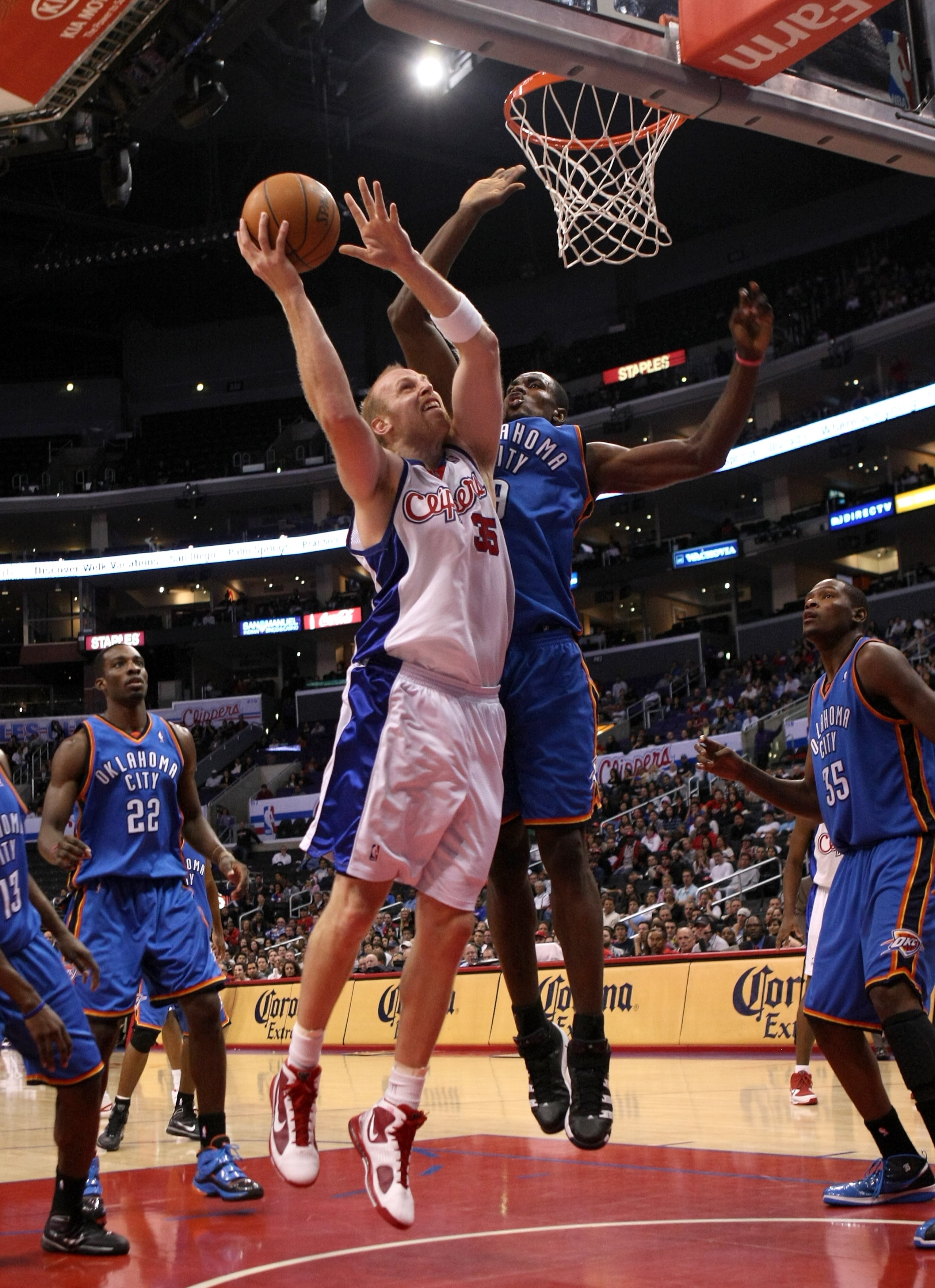 LOS ANGELES, CA - NOVEMBER 11:  Chris Kaman #35 of the Los Angeles Clippers shoots over Serge Ibaka #9 of the Oklahoma City Thunder on November 11, 2009 at Staples Center in Los Angeles, California.  The Thunder won 83-79.   NOTE TO USER: User expressly a