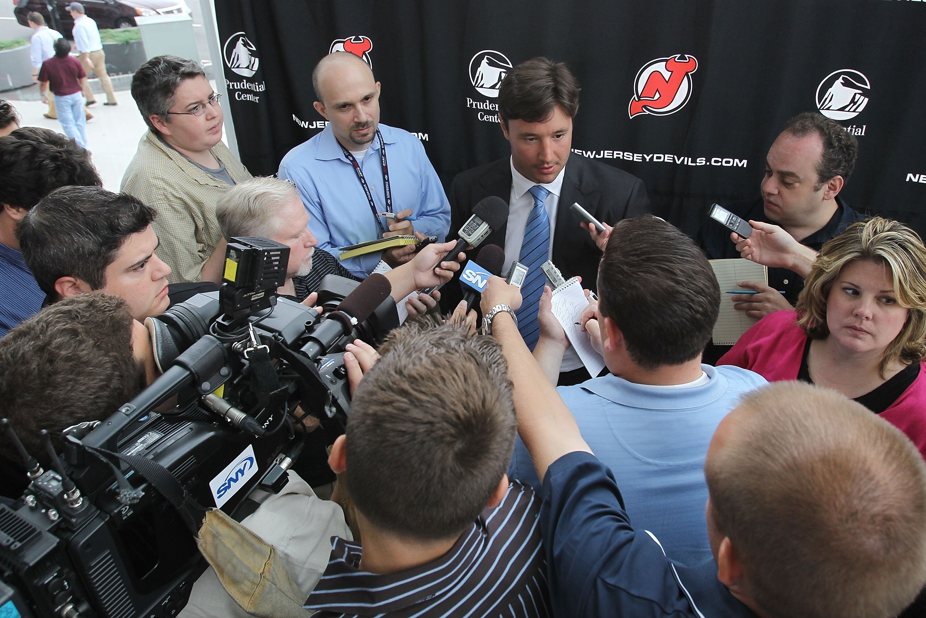 NEWARK, NJ - JULY 20: Ilya Kovalchuk of the New Jersey Devils speaks with the media after announcing his contract renewal at the Prudential Center on July 20, 2010 in Newark, New Jersey. (Photo by Bruce Bennett/Getty Images)