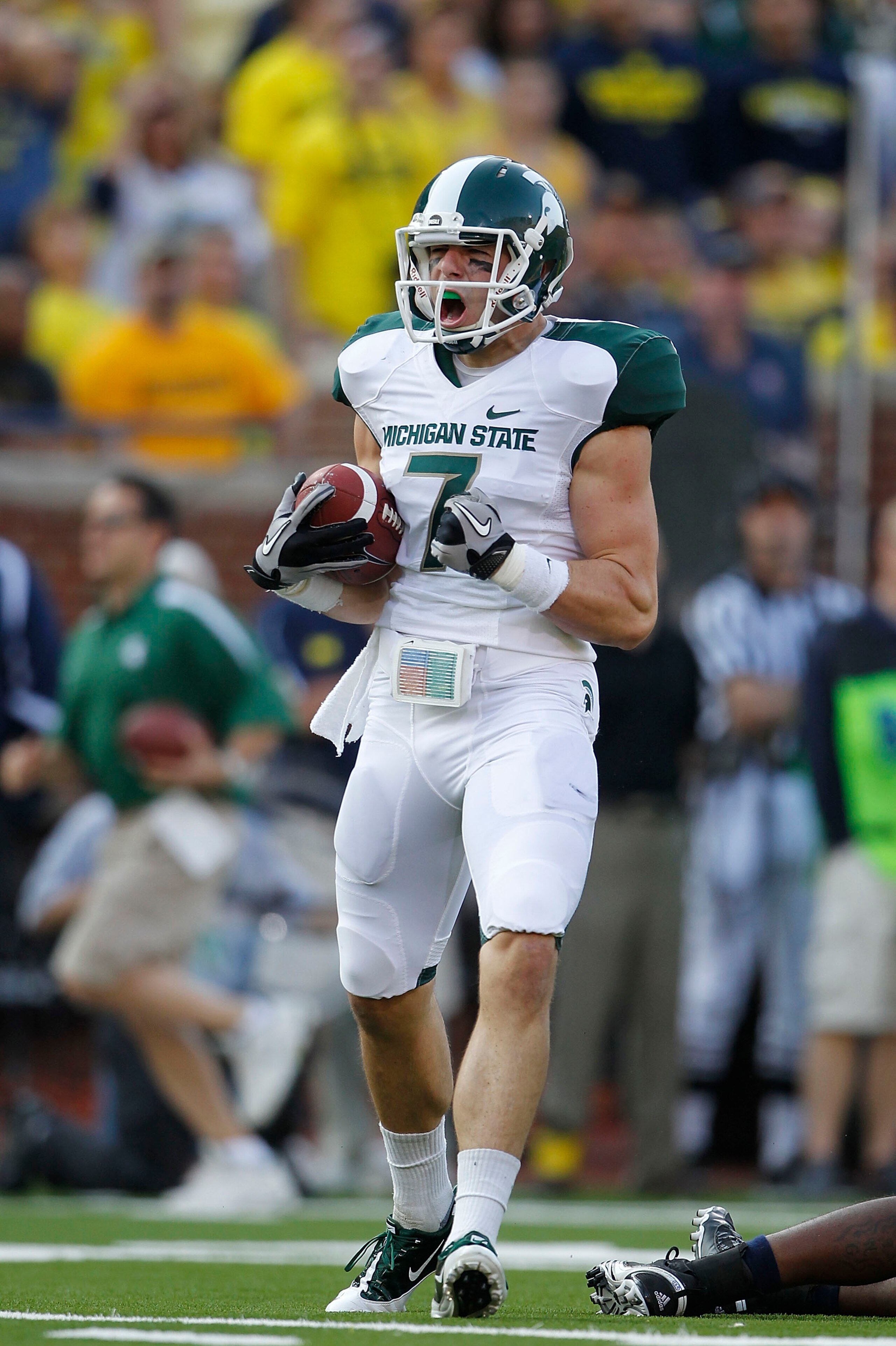 ANN ARBOR, MI - OCTOBER 09:  Steve Nichol #7 of the Michigan State Spartans celebrates a 42 yard pass compleation from Kirk Cousins #8 during the third quarter of the game against the Michigan Wolverines on October 9, 2010 at Michigan Stadium in Ann Arbor
