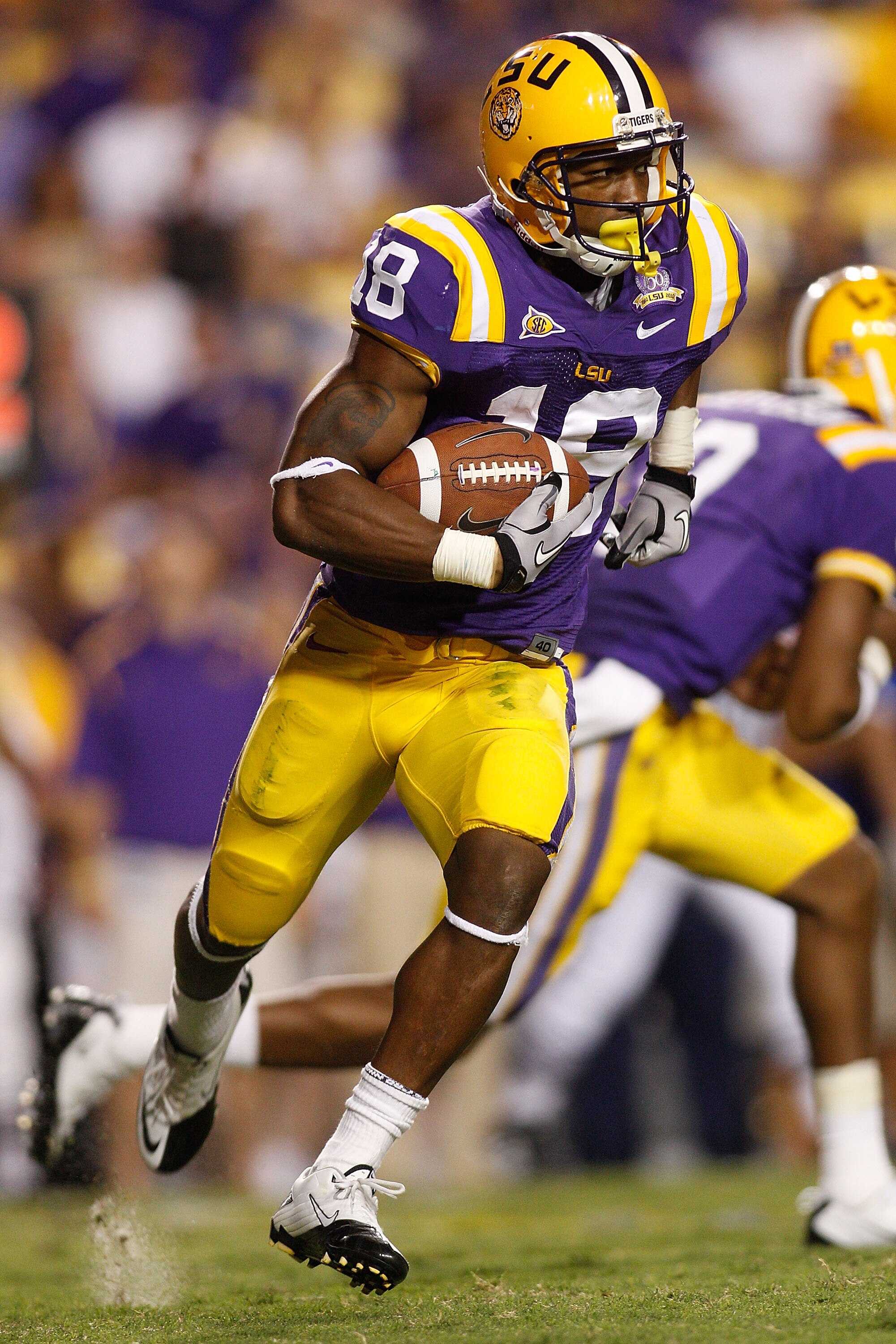 BATON ROUGE, LA - OCTOBER 16:  Richard Murphy #18 of the Louisiana State University Tigers runs the ball against the McNeese State Cowboys at Tiger Stadium on October 16, 2010 in Baton Rouge, Louisiana.  (Photo by Chris Graythen/Getty Images)