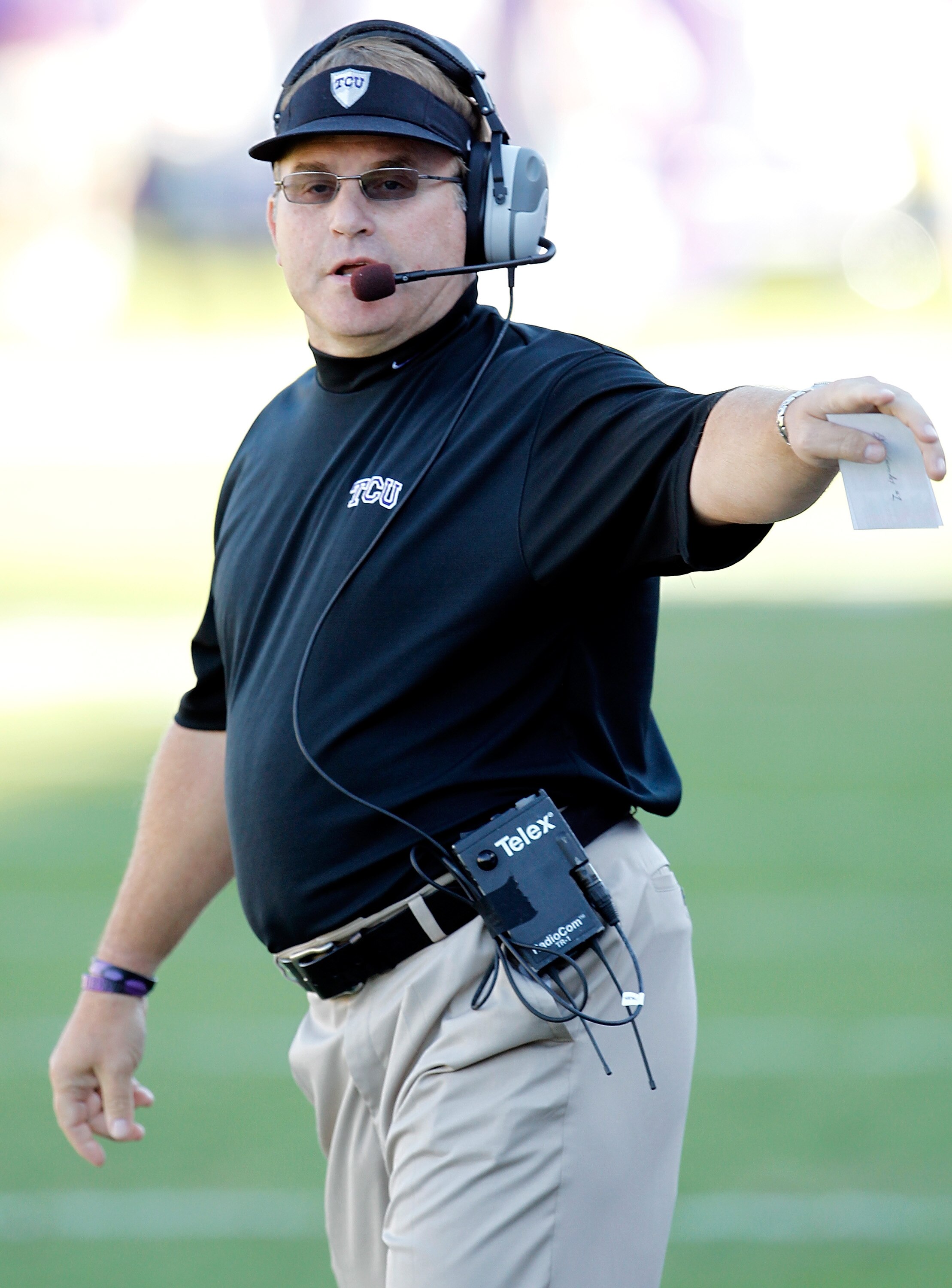 FORT WORTH, TX - OCTOBER 16:  Head coach Gary Patterson of the TCU Horned Frogs leads his team against the BYU Cougars at Amon G. Carter Stadium on October 16, 2010 in Fort Worth, Texas.  TCU beat BYU 31-3.  (Photo by Tom Pennington/Getty Images)