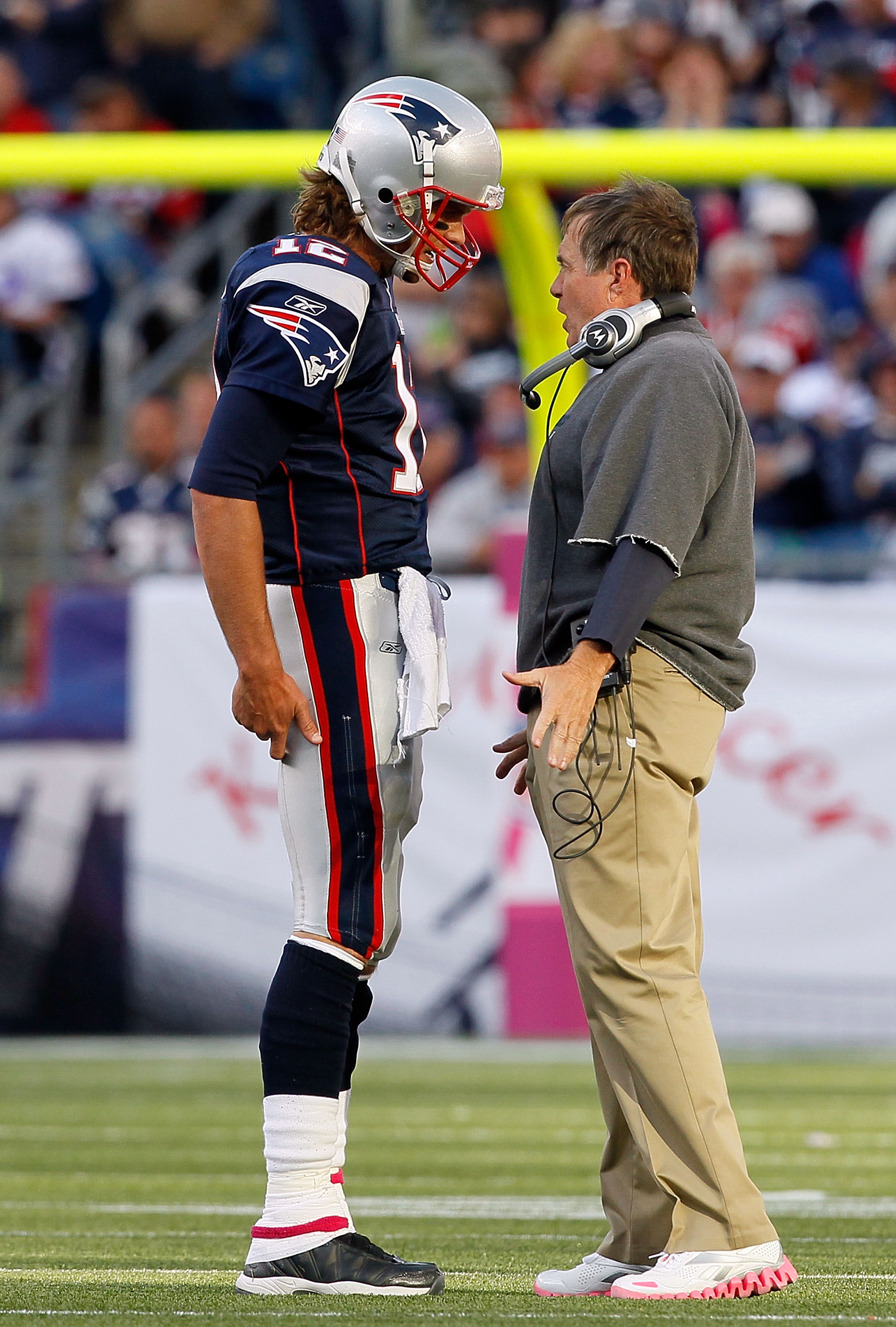 FOXBORO, MA - OCTOBER 17:  Coach Bill Belichick of the New England Patriots talks to his quarterback Tom Brady during a game against the Baltimore Ravens at Gillette Stadium on October 17, 2010 in Foxboro, Massachusetts. (Photo by Jim Rogash/Getty Images)