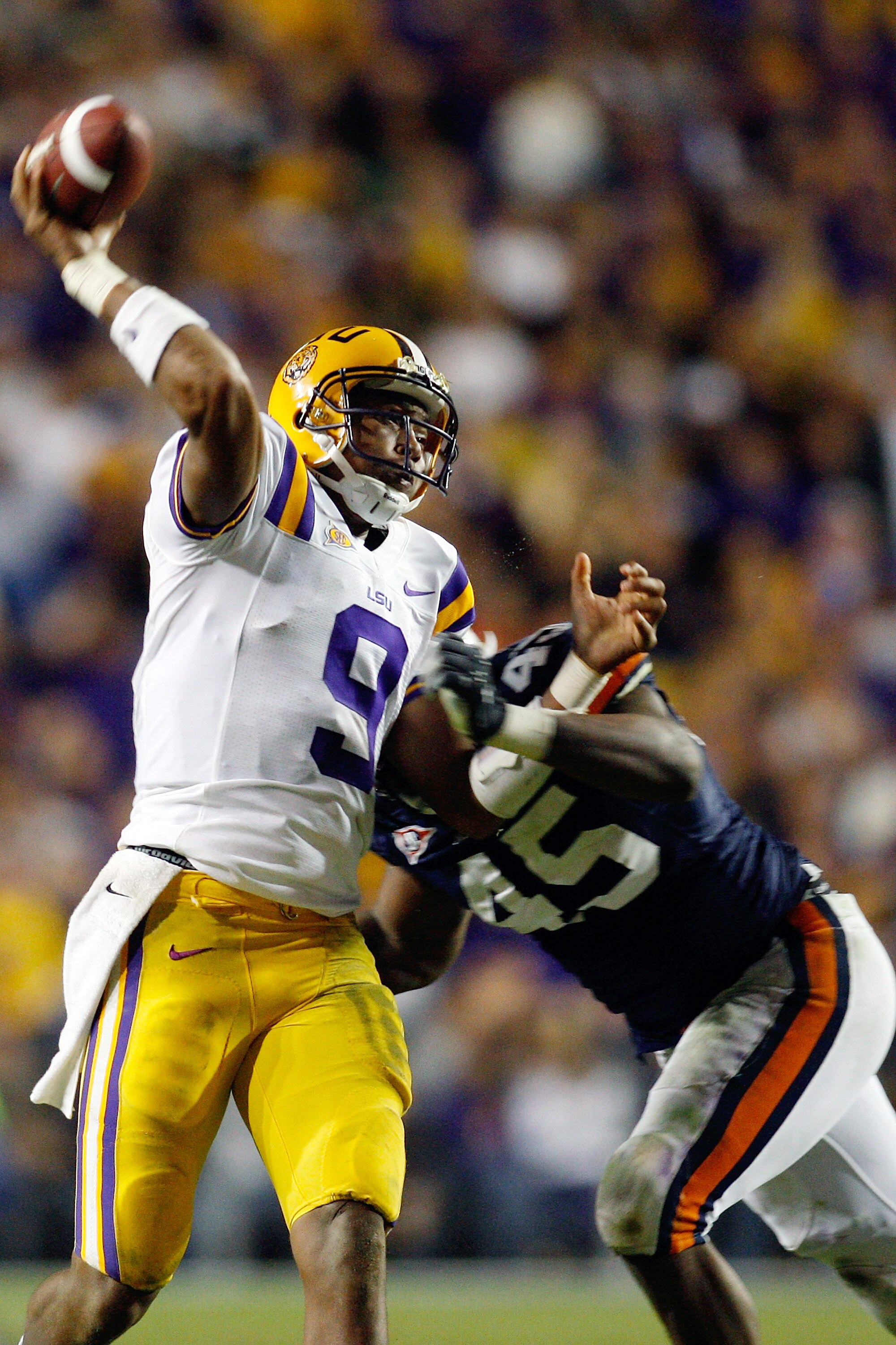 BATON ROUGE, LA - OCTOBER 24:  Jordan Jefferson #9 of the Louisiana State University Tigers is tackled as he throws the ball by Antoine Carter #45 of the Auburn Tigers at Tiger Stadium on October 24, 2009 in Baton Rouge, Louisiana.  (Photo by Chris Grayth