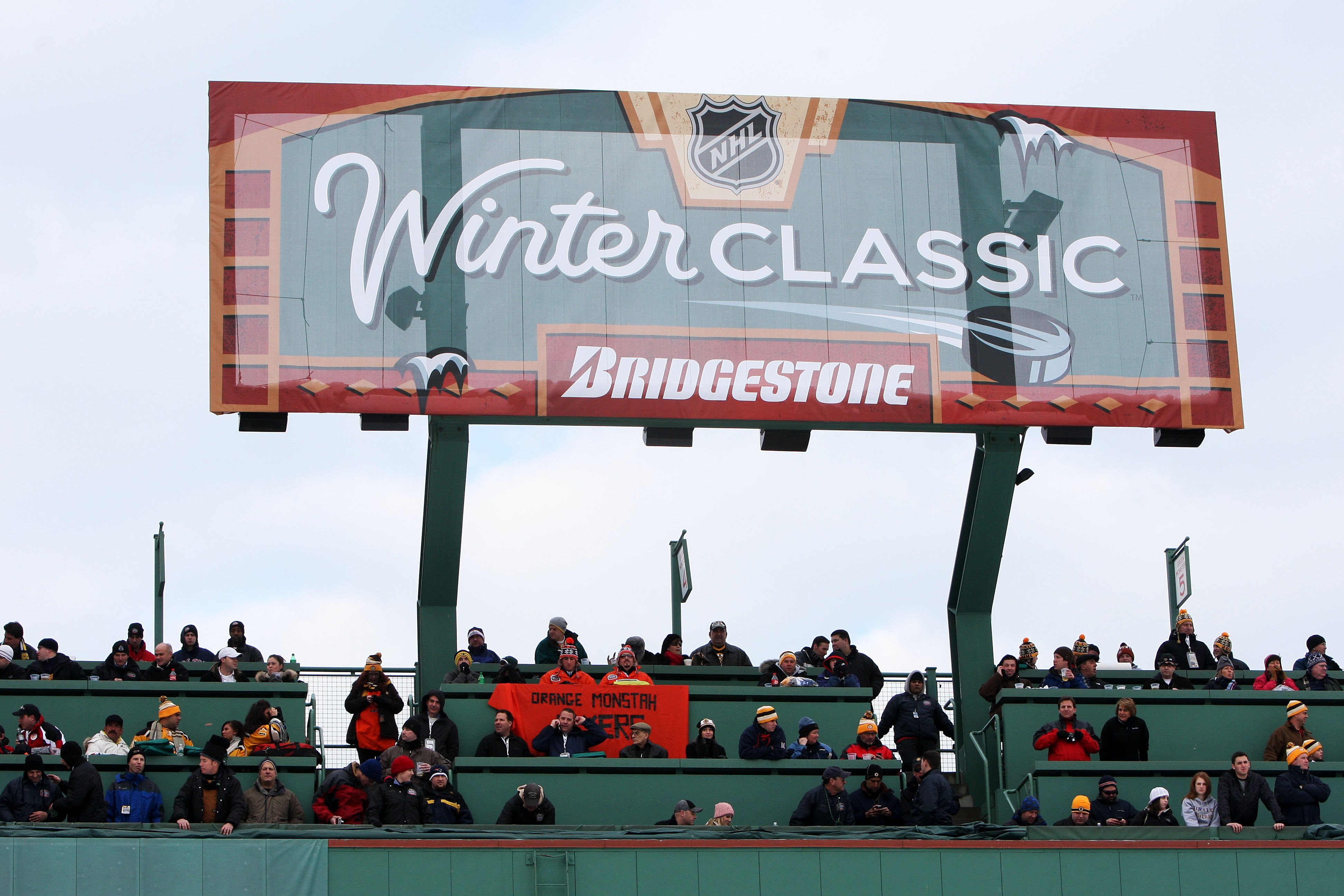 BOSTON - JANUARY 01:  Fans watch the game between the Philadelphia Flyers and the Boston Bruins during the 2010 Bridgestone Winter Classic at Fenway Park on January 1, 2010 in Boston, Massachusetts.  The Boston Bruins defeated the Philadelphia Flyers 2-1