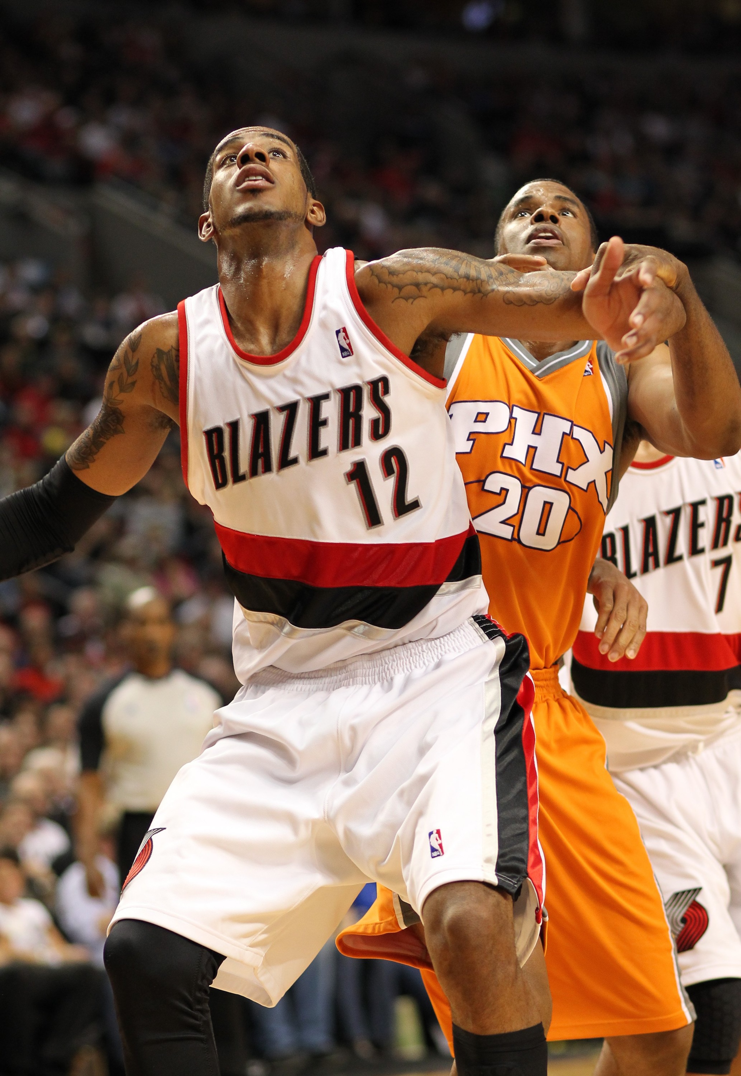 PORTLAND, OR - APRIL 24:  LaMarcus Aldridge #12 of the Portland Trail Blazers battles Jarron Collins #20 of the Phoenix Suns during Game Four of the Western Conference Quarterfinals of the NBA Playoffs on April 24, 2010 at the Rose Garden in Portland, Ore