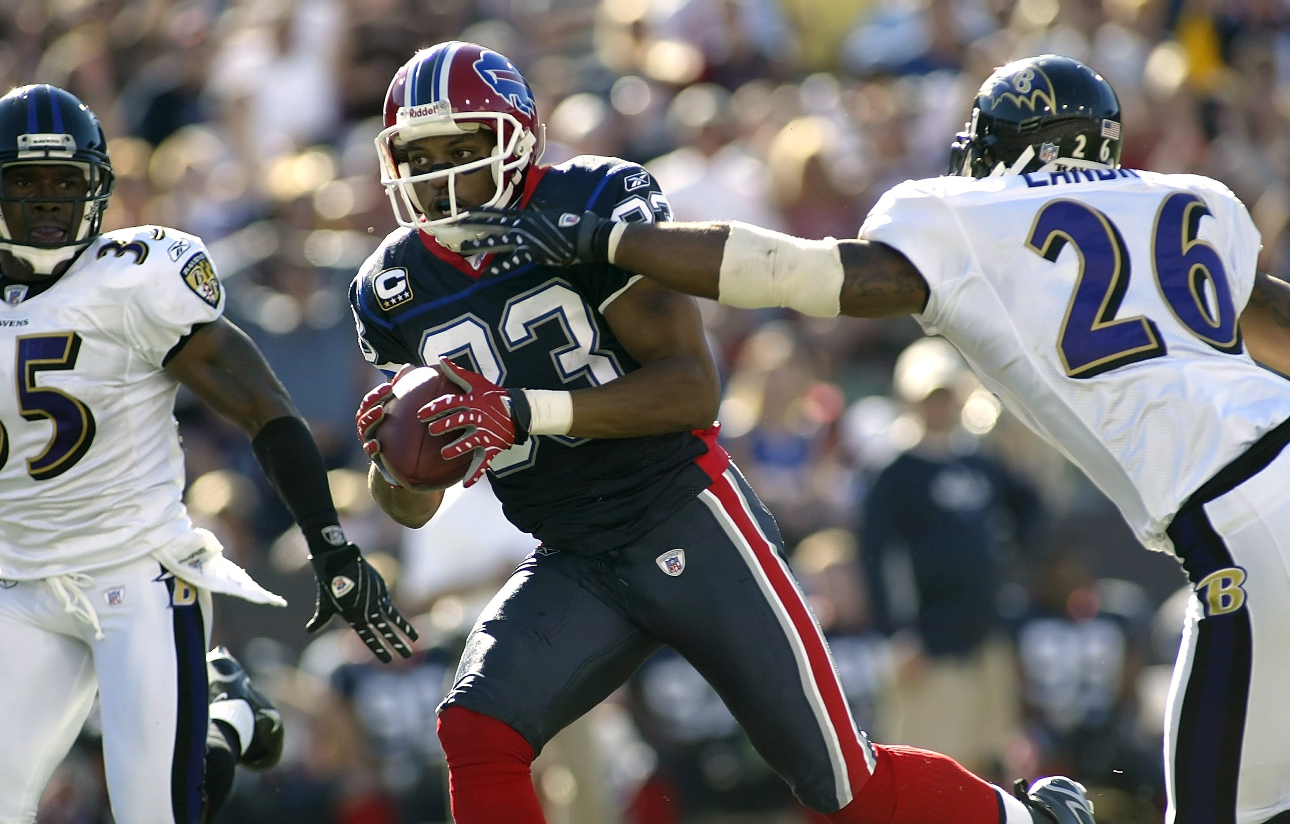ORCHARD PARK, NY - OCTOBER 21:  Lee Evans #83 of the Buffalo Bills runs past Dawan Landry #26  of the Baltimore Ravens on a 54 yard pass reception on October 21, 2007 at Ralph Wilson Stadium in Orchard Park, New York.  Buffalo won 19-14.  (Photo by Rick S