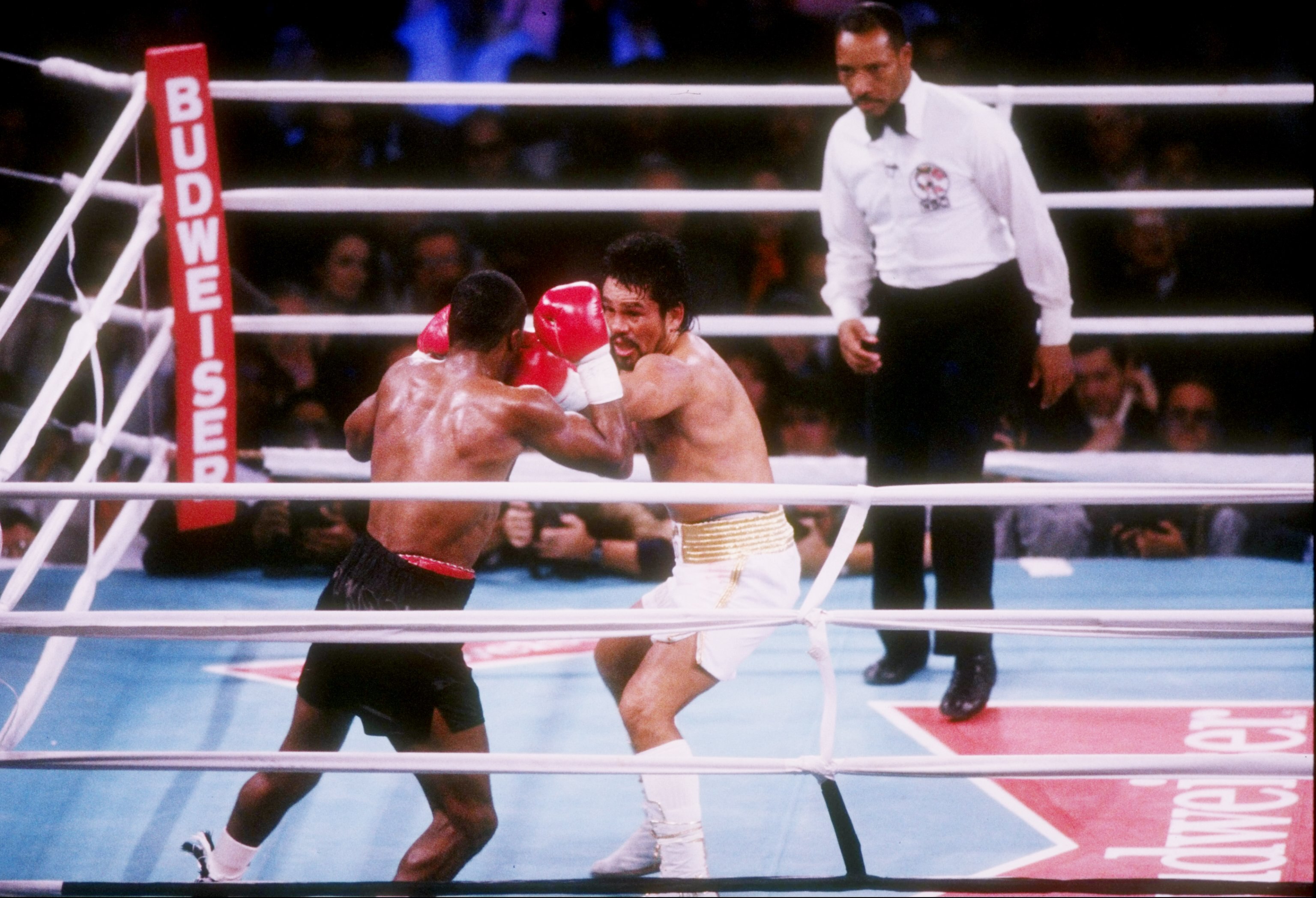 DEC 1989:  Roberto Duran (right) trades blows with Sugar Ray Leonard during their fight at The Mirage Hotel in Las Vegas, Nevada.