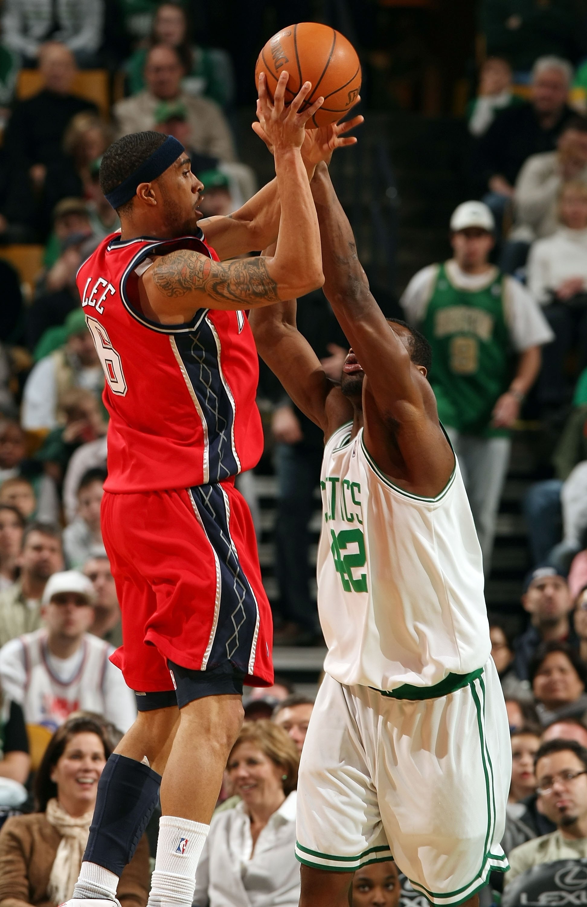BOSTON - FEBRUARY 27:  Courtney Lee #6 of the New Jersey Nets takes a shot as Tony Allen #42 of the Boston Celtics defends at the TD Garden on February 27, 2010 in Boston, Massachusetts. The Nets defeated the Celtics 104-96.  NOTE TO USER: User expressly