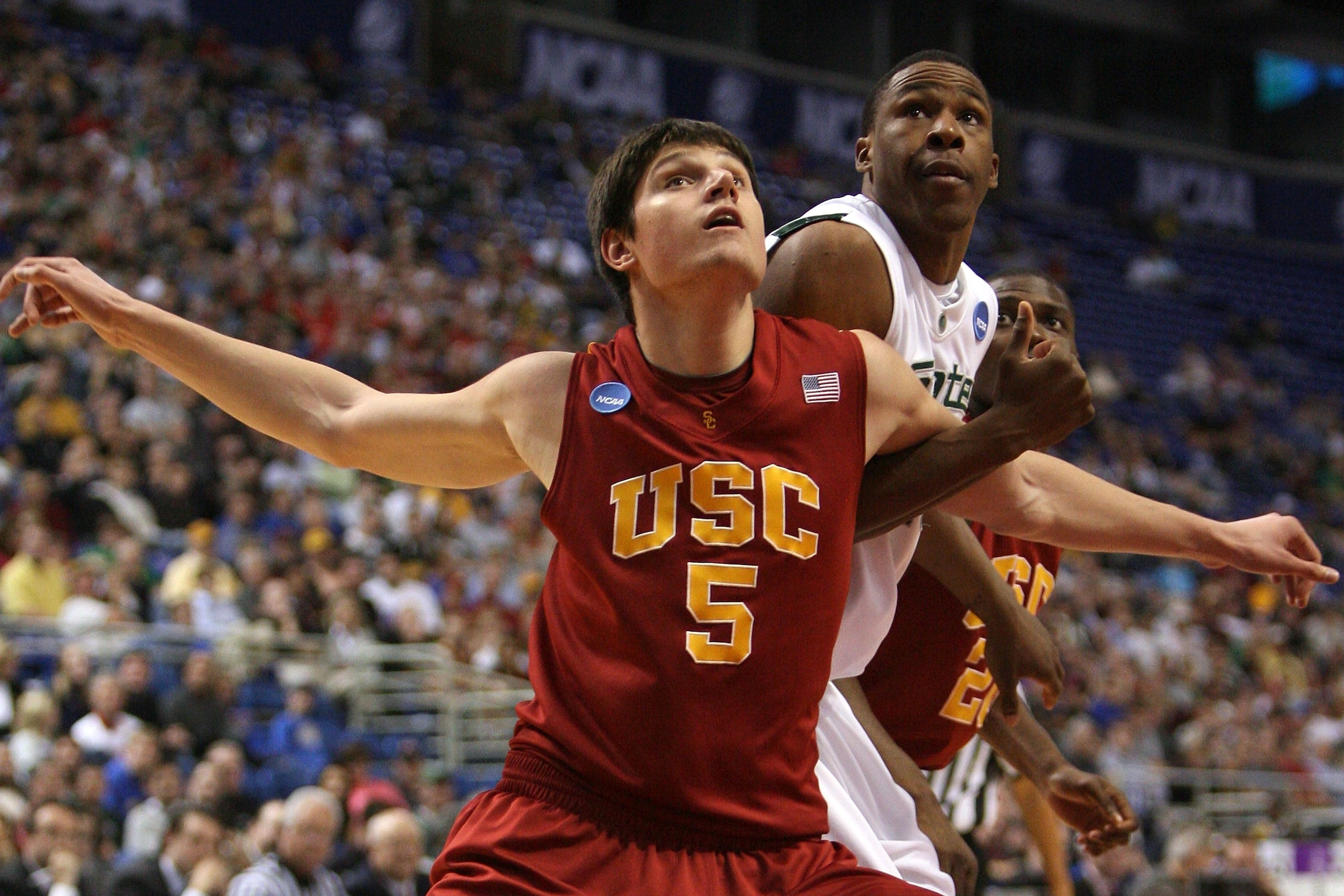MINNEAPOLIS - MARCH 22: Nikola Vucevic #5 of the USC Trojans fights for position under the basket against Delvon Roe #10 of the Michigan State Spartans during the second round of the NCAA Division I Men's Basketball Tournament at the Hubert H. Humphrey M MINNEAPOLIS - MARCH 22: Nikola Vucevic #5 of the USC Trojans fights for position under the basket against Delvon Roe #10 of the Michigan State Spartans during the second round of the NCAA Division I Men's Basketball Tournament at the Hubert H. Humphrey M