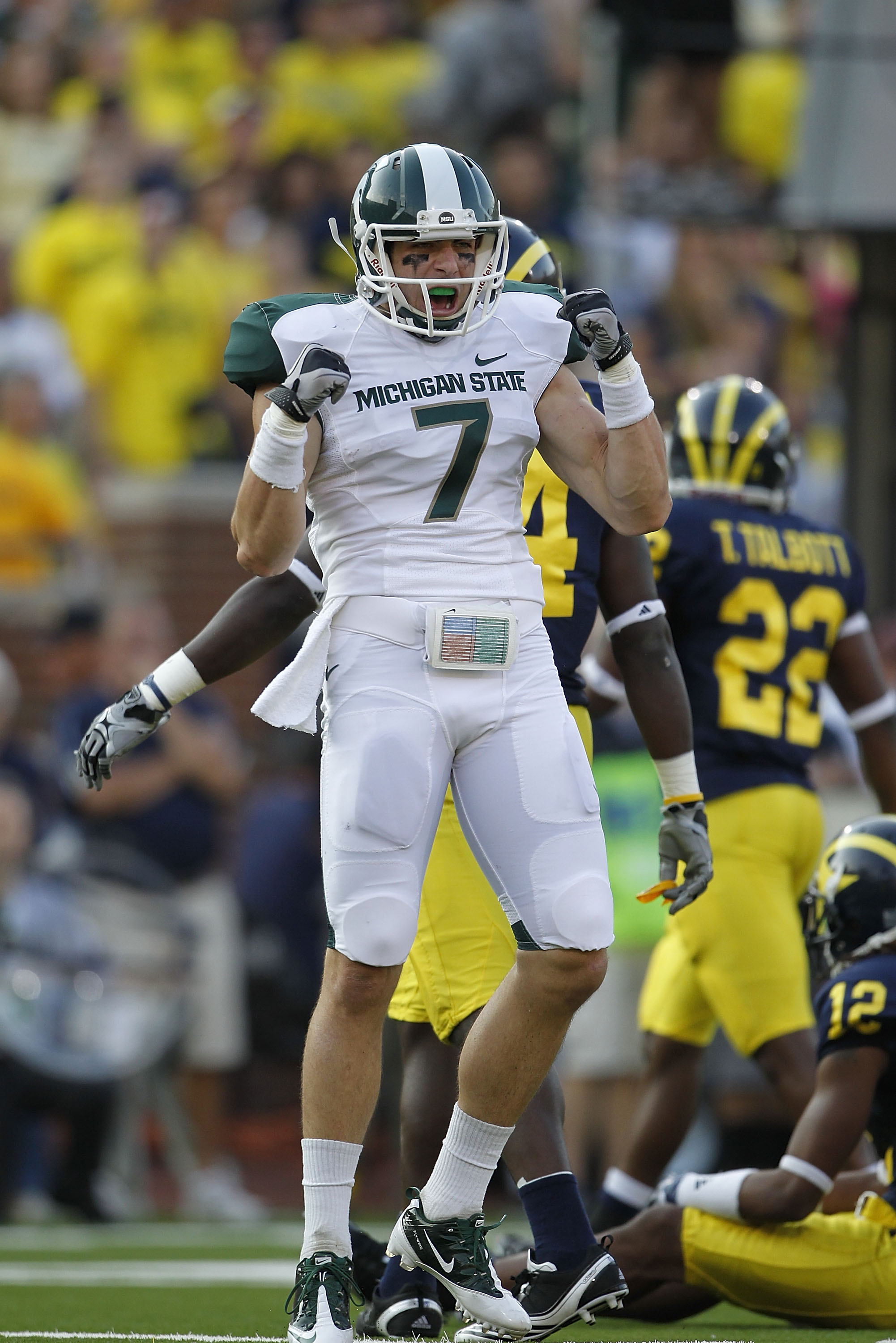 ANN ARBOR, MI - OCTOBER 09: Steve Nichol #7 of the Michigan State Spartans celebrates a 42 yard pass compleation from Kirk Cousins #8 during the third quarter of the game against the Michigan Wolverines on October 9, 2010 at Michigan Stadium in Ann Arbor,