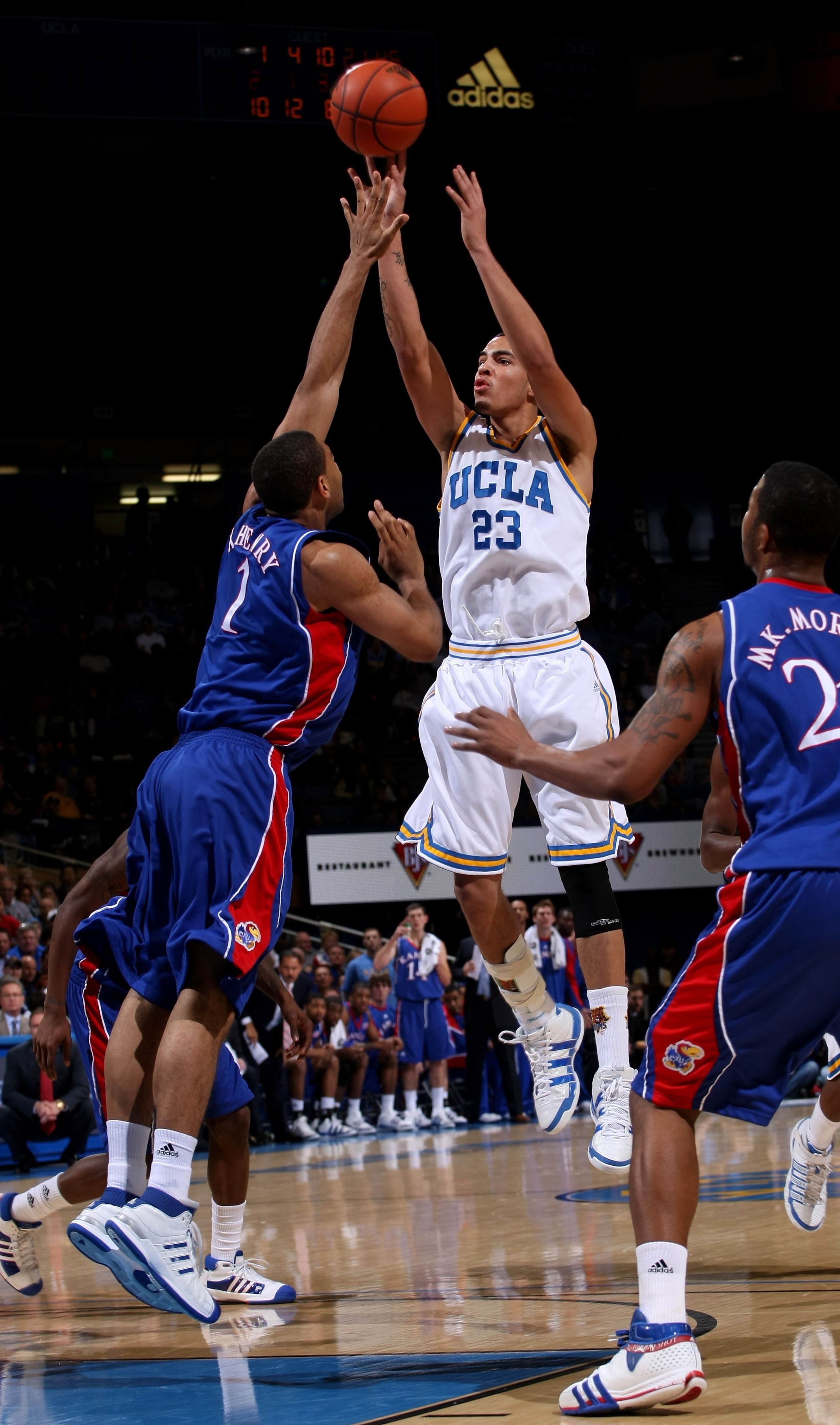 WESTWOOD, CA - DECEMBER 06: Tyler Honeycutt #23 of the UCLA Bruins shoots over Xavier Henry #1 of the Kansas Jayhawks on December 6, 2009 at Pauley Pavillion in Westwood, California. Kansas won 73-61. (Photo by Stephen Dunn/Getty Images) WESTWOOD, CA - DECEMBER 06: Tyler Honeycutt #23 of the UCLA Bruins shoots over Xavier Henry #1 of the Kansas Jayhawks on December 6, 2009 at Pauley Pavillion in Westwood, California. Kansas won 73-61. (Photo by Stephen Dunn/Getty Images)