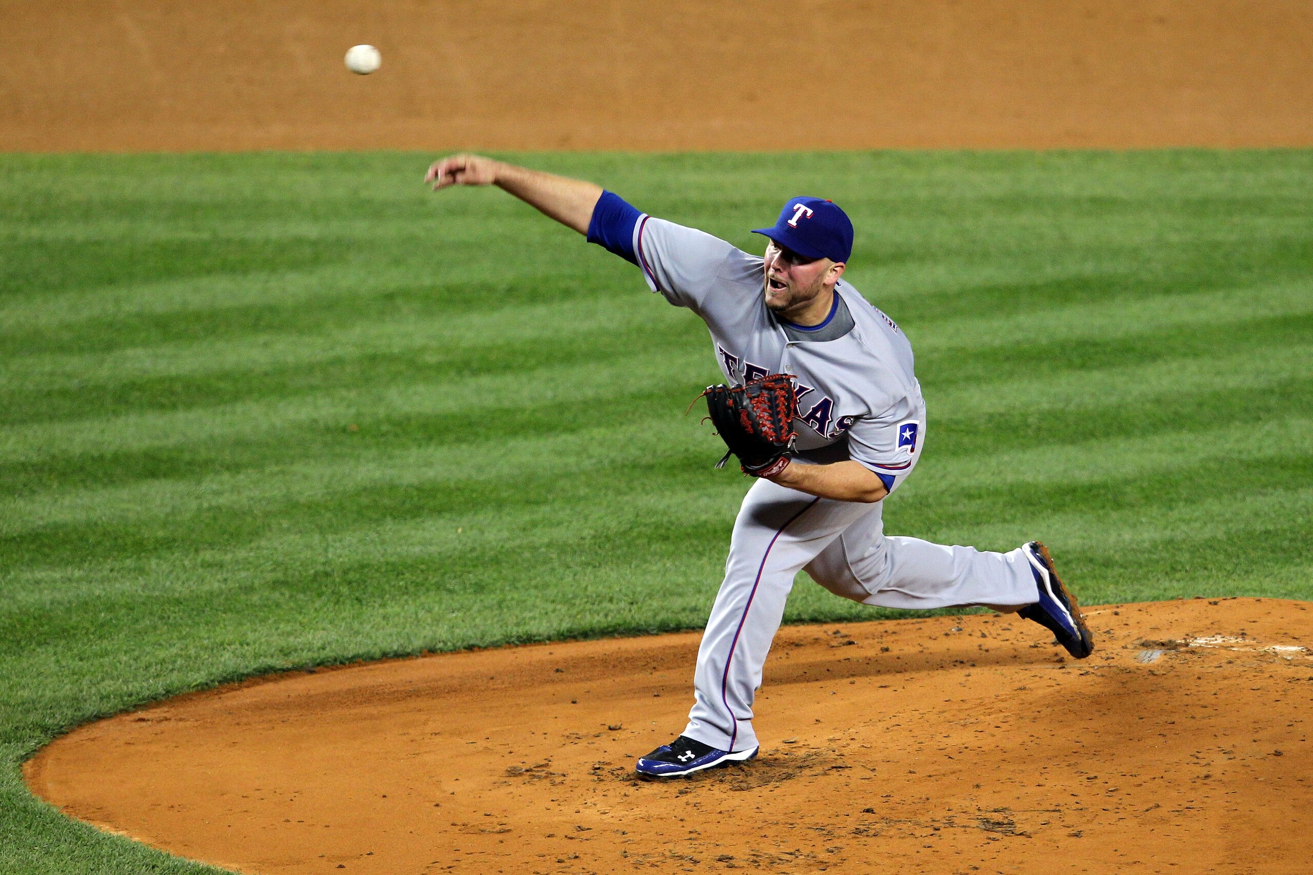 NEW YORK - OCTOBER 19:  Tommy Hunter #35 of the Texas Rangers pitches against the New York Yankees in Game Four of the ALCS during the 2010 MLB Playoffs at Yankee Stadium on October 19, 2010 in the Bronx borough of New York City.  (Photo by Nick Laham/Get