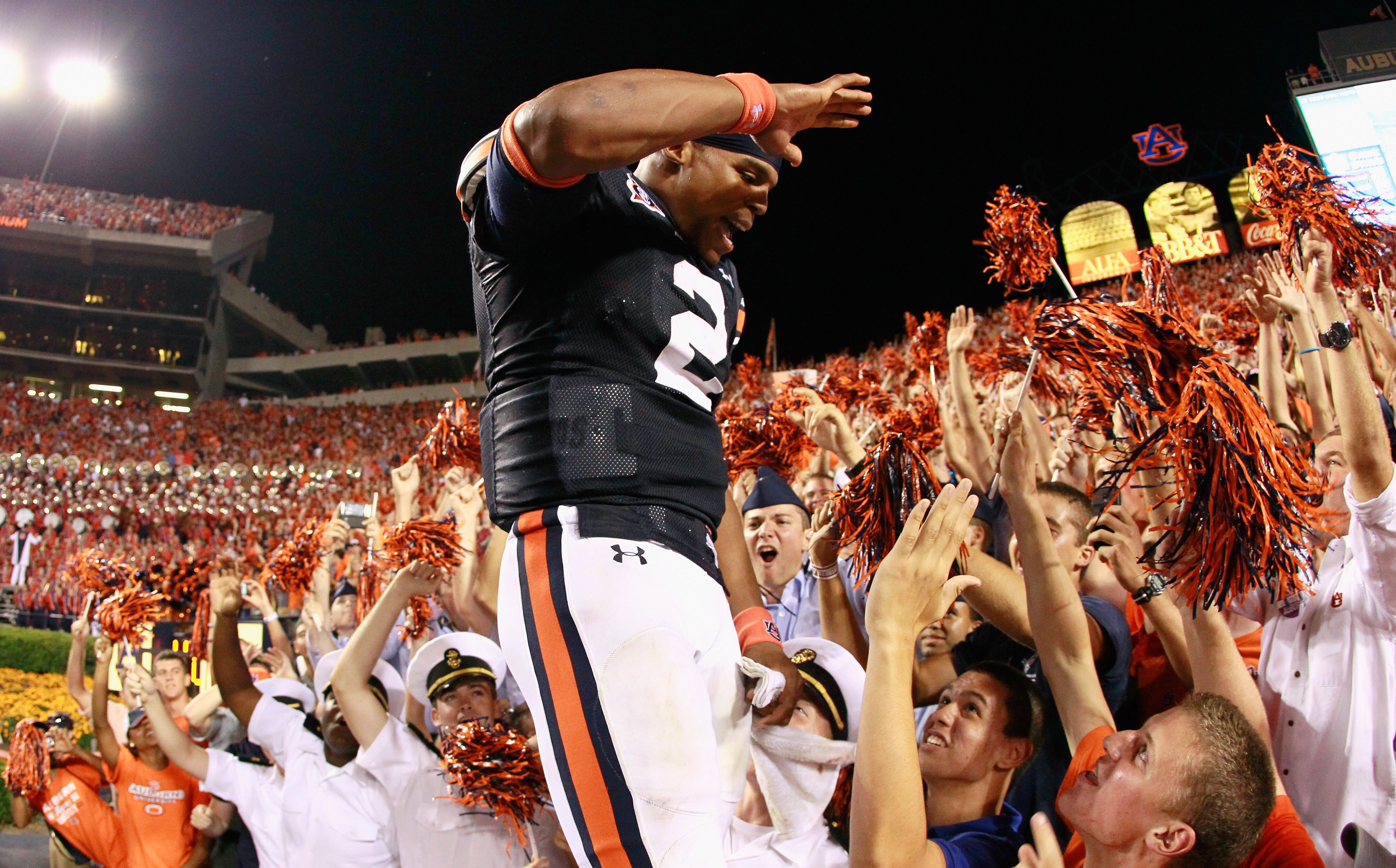 AUBURN, AL - SEPTEMBER 25:  Quarterback Cameron Newton #2 of the Auburn Tigers celebrates in the stands after their 35-27 win over the South Carolina Gamecocks at Jordan-Hare Stadium on September 25, 2010 in Auburn, Alabama.  (Photo by Kevin C. Cox/Getty